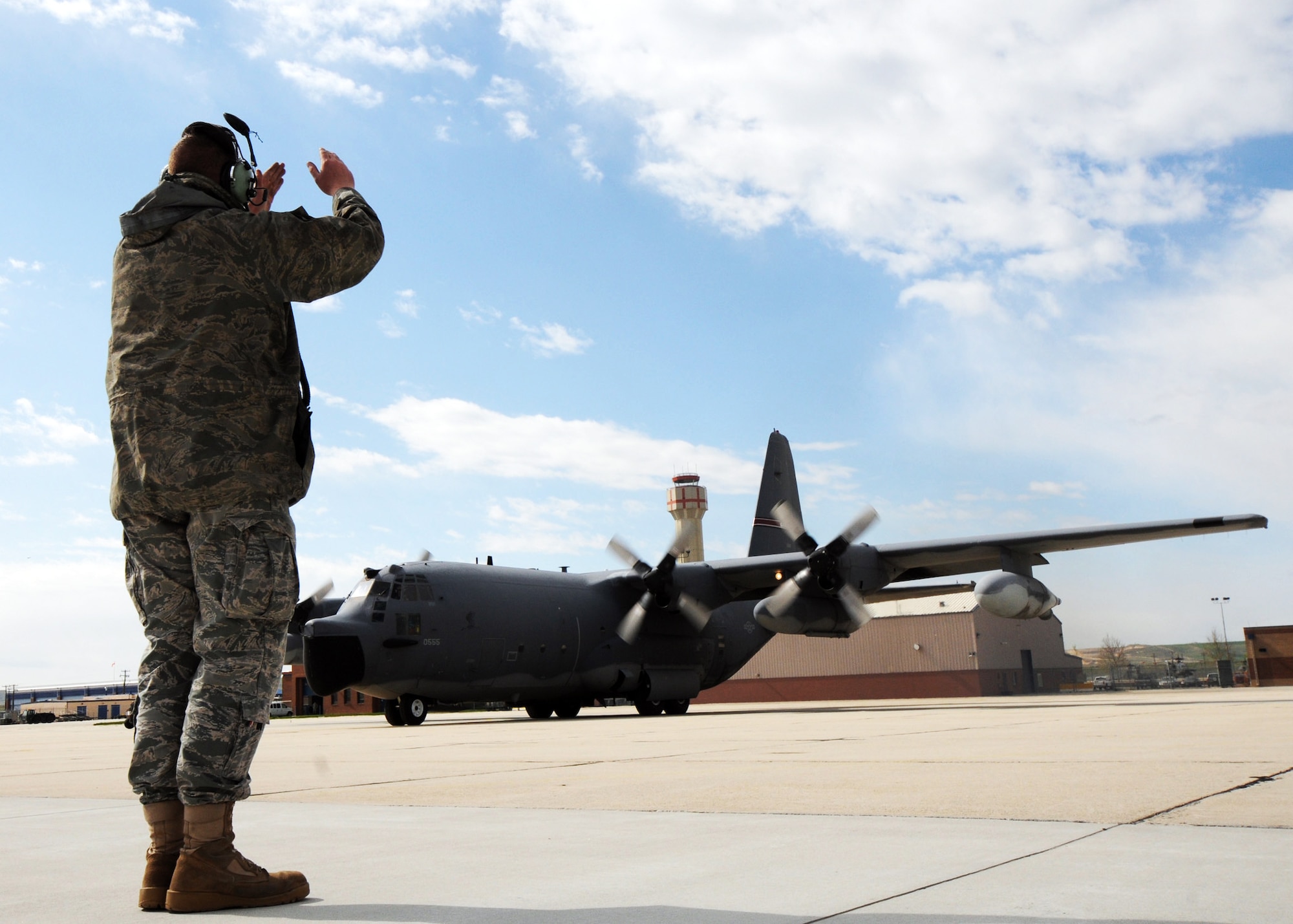 Staff Sgt. Travis Hooper, 179th Maintenance Group, marshals out MC-130E Combat Talon #555 prior to its final flight May 5 from Gowen Field, Idaho.  919th Special Operations Wing maintainers, along with the 179th were sent to Boise, Idaho, to prepare four Talons to take off for one more mission – a flight into retirement and decommissioning.  Three of the Talons flew to Davis-Monthan Air Force Base, Ariz.  The other went to Hurlburt Field, Fla., to be placed in the Air Force Special Operations Command airpark.  (U.S. Air Force photo/Tech. Sgt. Samuel King Jr.)  