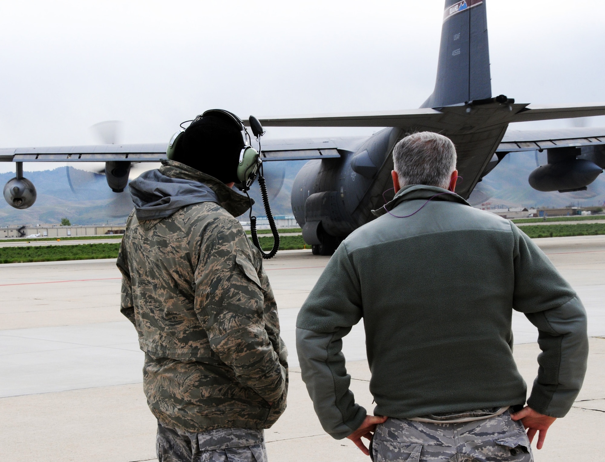 Senior Master Sgt. William McAnelly and Chief Master Sgt. Ken Potter, 919th Maintenance Group, watch as MC-130E Combat Talon #555 taxis out for the last time May 5 from Gowen Field, Idaho.  919th maintainers were sent to Boise, Idaho, to prepare four Talons to take off for one more mission – a flight into retirement and decommissioning.  Three of the Talons flew to Davis-Monthan Air Force Base, Ariz.  The other went to Hurlburt Field, Fla., to be placed in the Air Force Special Operations Command airpark.  (U.S. Air Force photo/Tech. Sgt. Samuel King Jr.)  