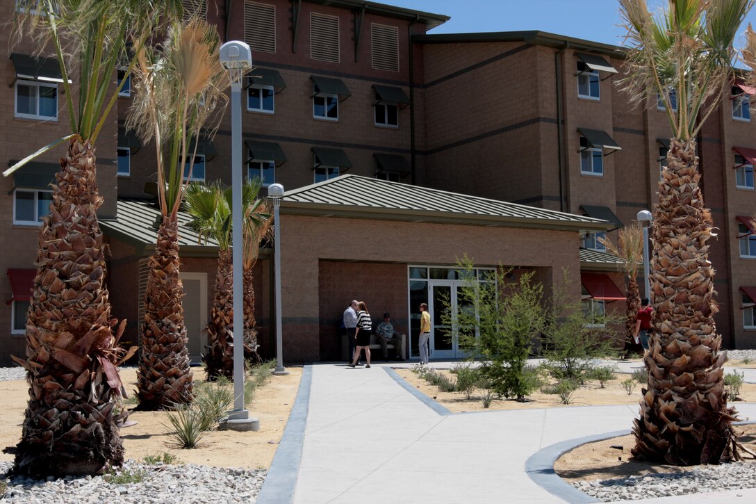 People gather for the ribbon cutting ceremony for the new 3rd Battalion, 11th Marine Regiment’s barracks May 24. The building and its surroundings were designed to look more like a hotel than a traditional barracks.