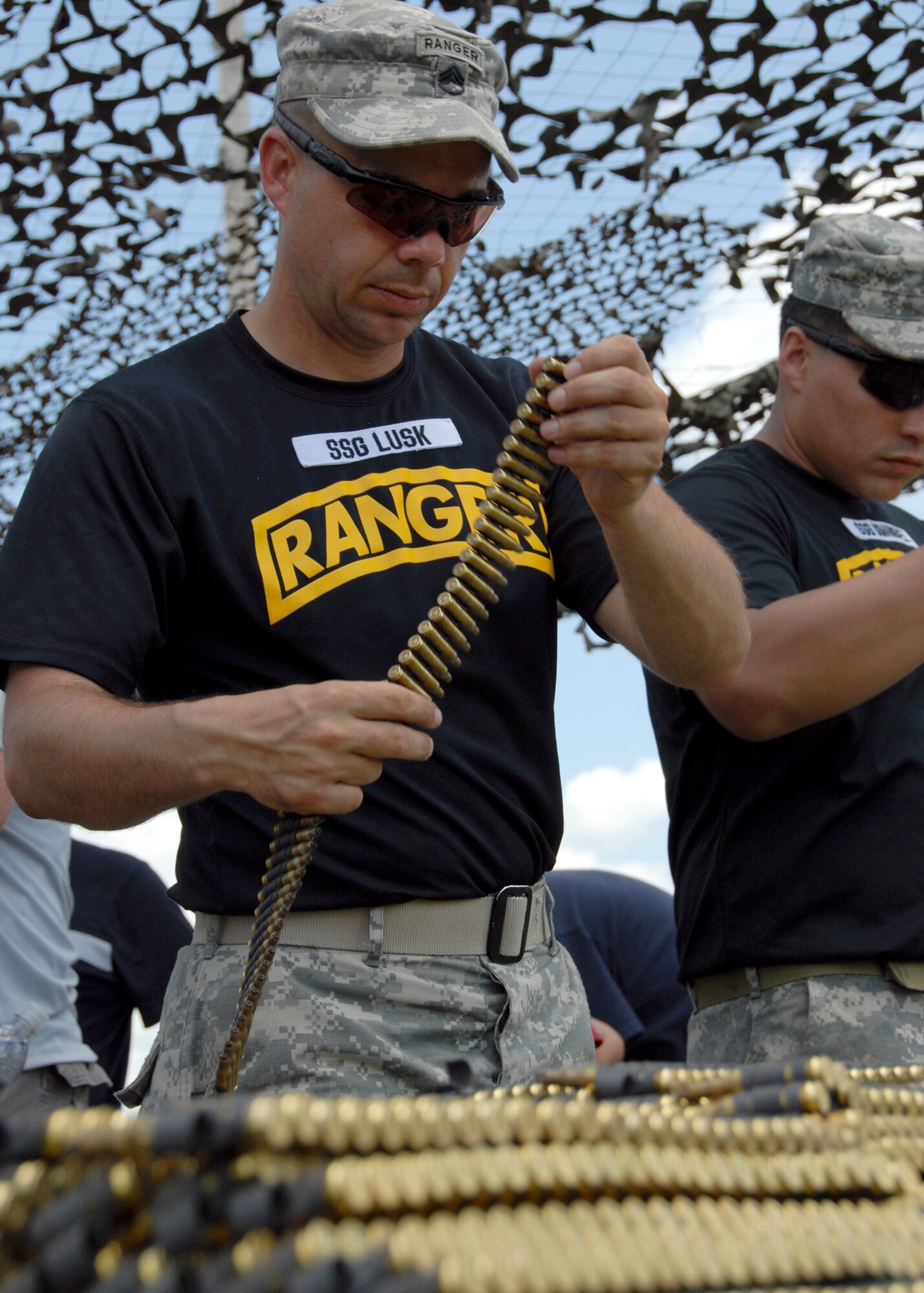 Staff Sgt. Lusk, 6th Ranger Training Battalion, stacks ammunition during the Ranger Open House May 22.  The event was a chance for the public to learn how Rangers train and operate in extreme situations. The event displays such as dive equipment, weapons, and zodiac boats and demonstrations like hand-to-hand combat, parachute jump, and an urban operations demonstration.  (U.S. Air Force photo/Samuel King Jr.)