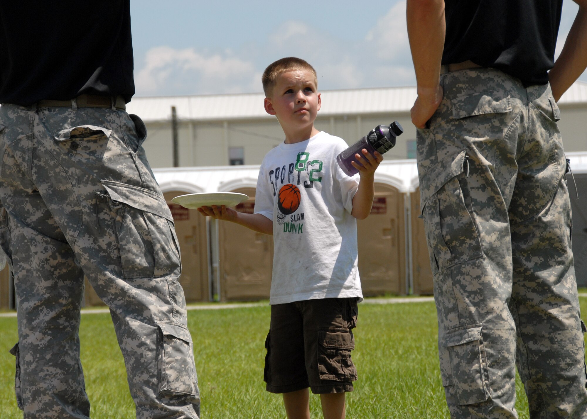 A potential recruit looks for help from two rangers during the Ranger Open House May 22.  The event was a chance for the public to learn how Rangers train and operate in extreme situations. The event displays such as dive equipment, weapons, and zodiac boats and demonstrations like hand-to-hand combat, parachute jump, and an urban operations demonstration.  (U.S. Air Force photo/Samuel King Jr.)