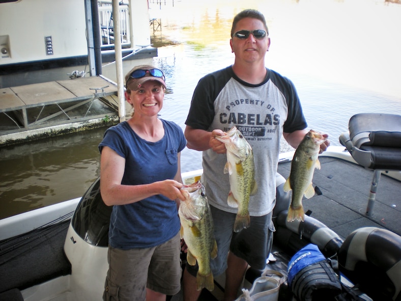 EUFAULA, Ala. -- Master Sgt. Danny Christ, 5th Bomb Wing staff and 5th Medical Group first sergeant, and his wife Staff Sgt. Virginia Christ, 5th Security Forces Squadron security controller, pose with a day’s catch during the 20th Annual Military Bass Angler Team Tournament held at the Lake Point Marina on Lake Eufaula near Eufaula, Ala., May 2 to May 7. The annual military tournament hosted a record setting 159 teams consisting of members from all active duty components from all across the country. (Courtesy photo)