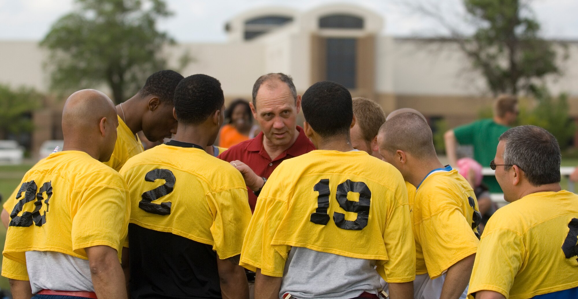 McConnell’s chiefs and first sergeants team discusses strategies with Tim Murphy, Harvard University head football coach, during the 2010 NCAA Coaches Tour at the Krueger Recreational Area May 22, 2010 McConnell Air Force Base. McConnell kicked off the 2010 Coaches Tour with a 5K run, a burger burn, autograph session and a flag football game. A 22nd Air Refueling Wing Stratotanker airlifted Coach Tim Murphy, Oregon head coach Chip Kelly, Illinois head coach Ron Zook and West Point head coach Rich Ellerson, on an eight-day tour to visit military installations worldwide. (U.S. Air Force photo/Airman Armando A. Schwier-Morales)