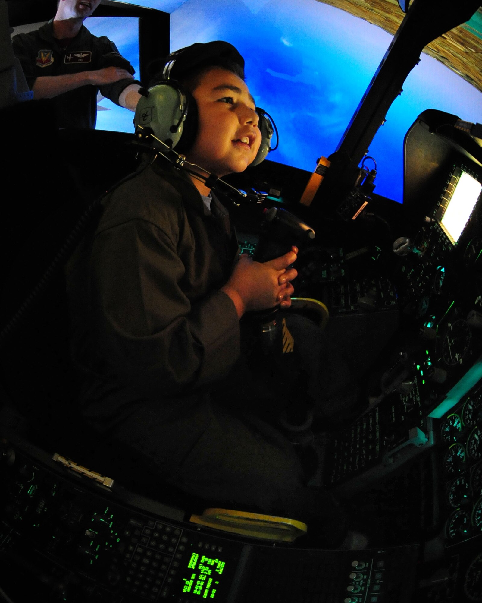 Eight-year-old Nathan Hoffmann experiences flight inside an A-10 simulator as part of his tour as Pilot for a Day at the 355th Operations Group here May 21. As this month’s Pilot for a Day, Nathan and his family were provided with a tour of the base to include the 357th Fighter Squadron, the air traffic control tower, the D-M Fire Department and several aircraft static displays. (U.S. Air Force photo/Airman Jerilyn Quintanilla)

