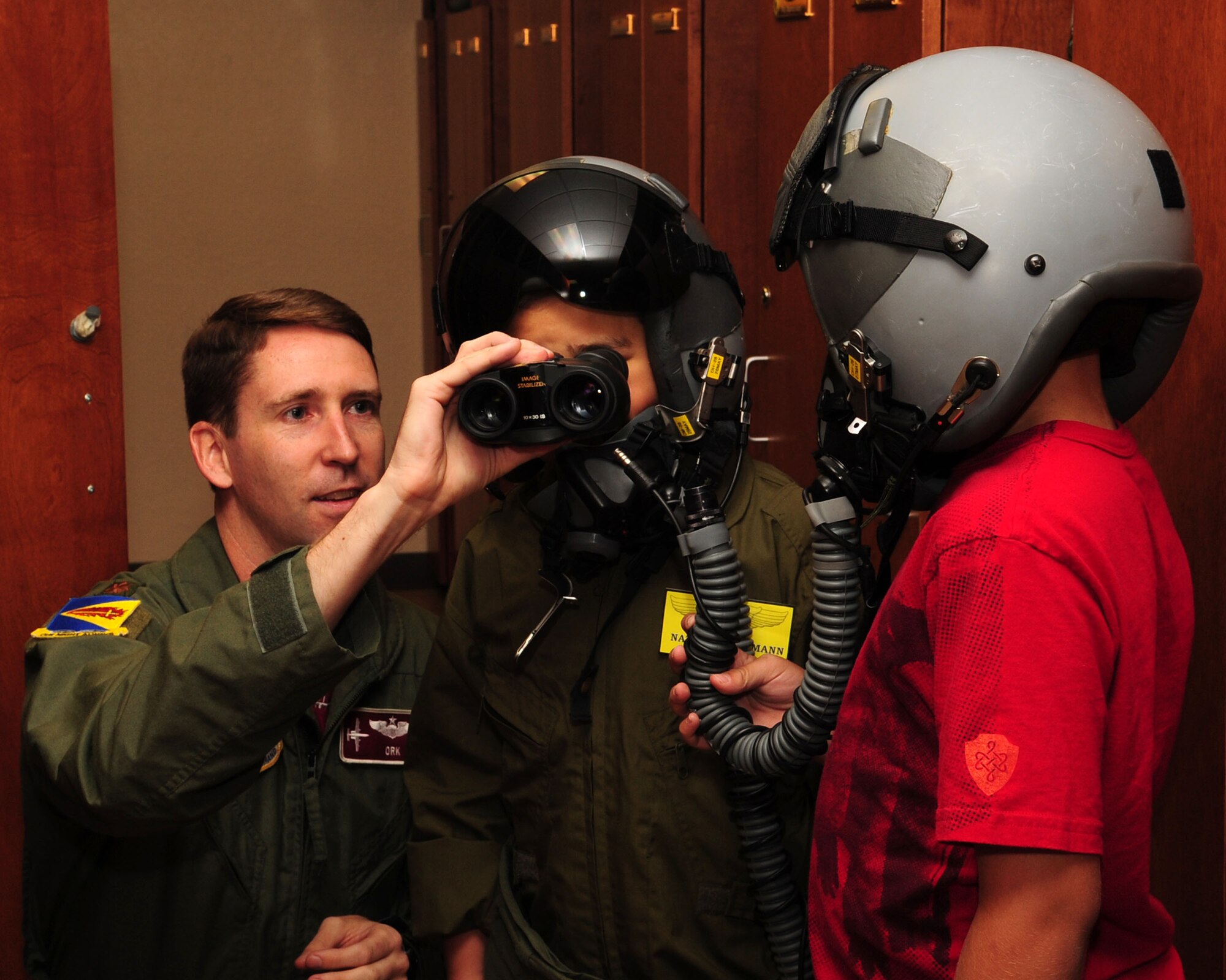 Eight-year-old Nathan Hoffmann looks through binoculars during his tour of the 357th Fighter Squadron here May 21. As this month’s Pilot for a Day, Nathan and his family were provided with a tour of the base to include the air traffic control tower, the D-M Fire Department and several aircraft static displays. The Pilot for a Day program is designed to help children with disabilities or serious illnesses enjoy a day focused on them and their interest in aviation. (U.S. Air force photo/Airman Jerilyn Quintanilla)