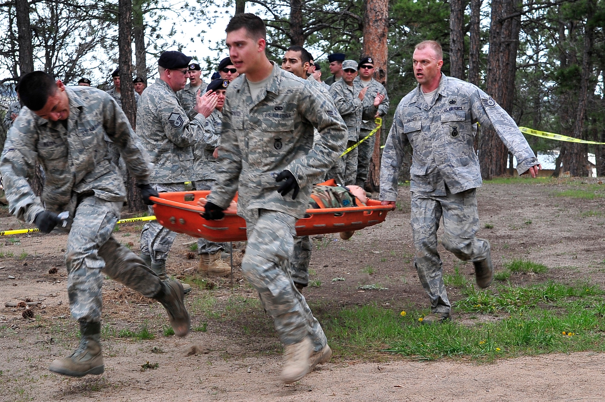 U.S. AIR FORCE ACADEMY, Colo. -- Competitors from the combined 460th Space Wing and 137th Space Warning Squadron team run their last obstacle during Air Force Space Command's Guardian Challenge 2010, May 19. (U.S. Air Force photo by Staff Sgt. Kathrine McDowell)