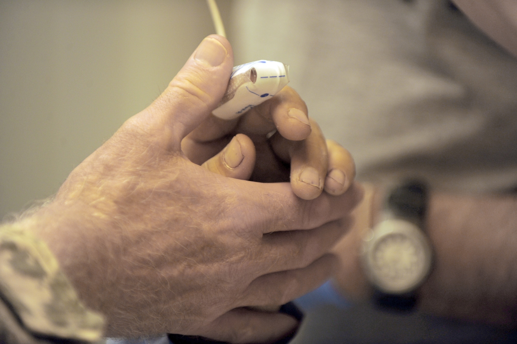 Army Lt. Col. (Dr.) Bob Kieffer checks the vitals of an Afghan man May 12, 2010, at Forward Operating Base Salerno, Afghanistan. Doctor Kieffer is a vascular surgeon assigned to the 452nd Combat Support Hospital. (U.S. Air Force photo/Staff Sgt. Manuel J. Martinez)
