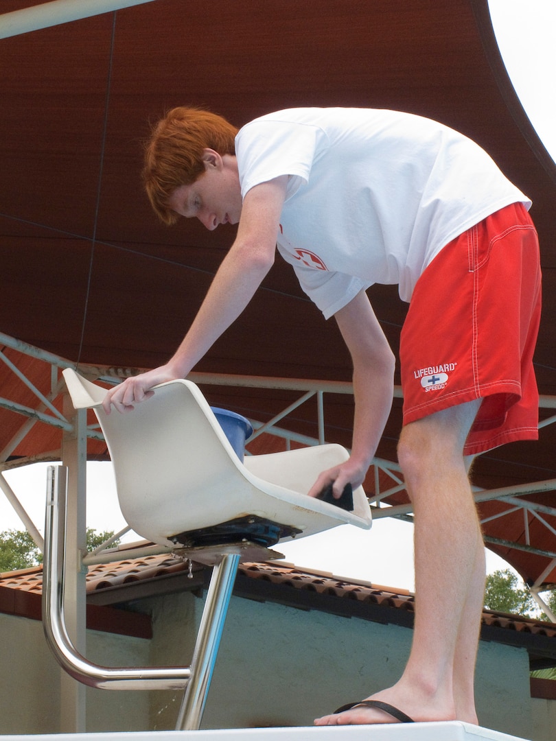 Brian Delaney, Randolph Air Force Base lifeguard, cleans a lifeguard observation chair during preparation for the 2010 swimming season. (U.S. Air Force photo/Steve Thurow)