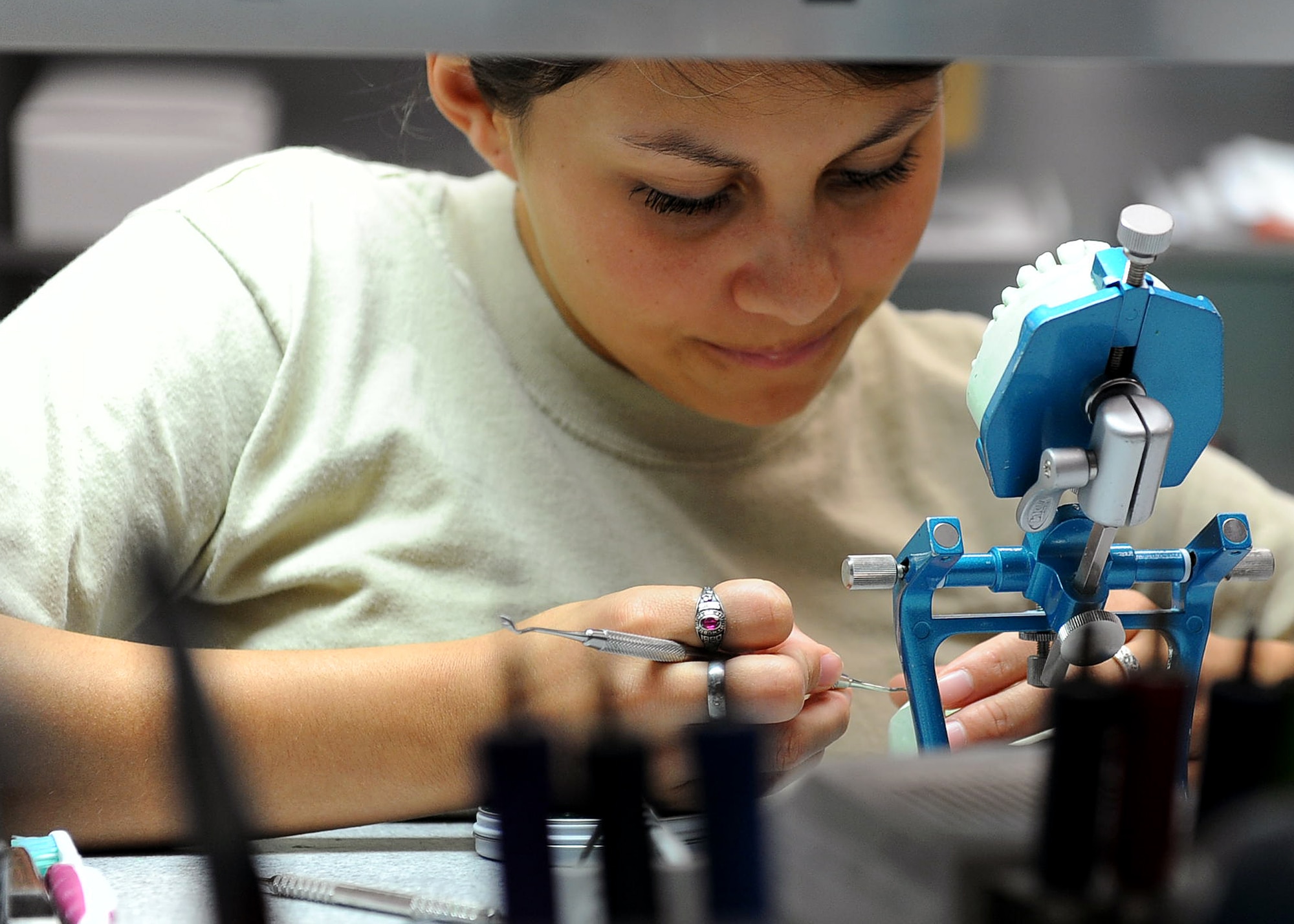 LANGLEY AIR FORCE BASE, Va. -- Airman Alyssa Carrillo, 633d Dental Squadron laboratory technician. fabricates a crown on a dental impression May 6.  Boasting a 31-room facility and a satellite clinic within the base’s main hospital, the 633 DS provides world-class care in all areas of general dentistry to more than 37,000 patients annually. (U.S. Air Force photo/Airman 1st Class Gul Crockett)
