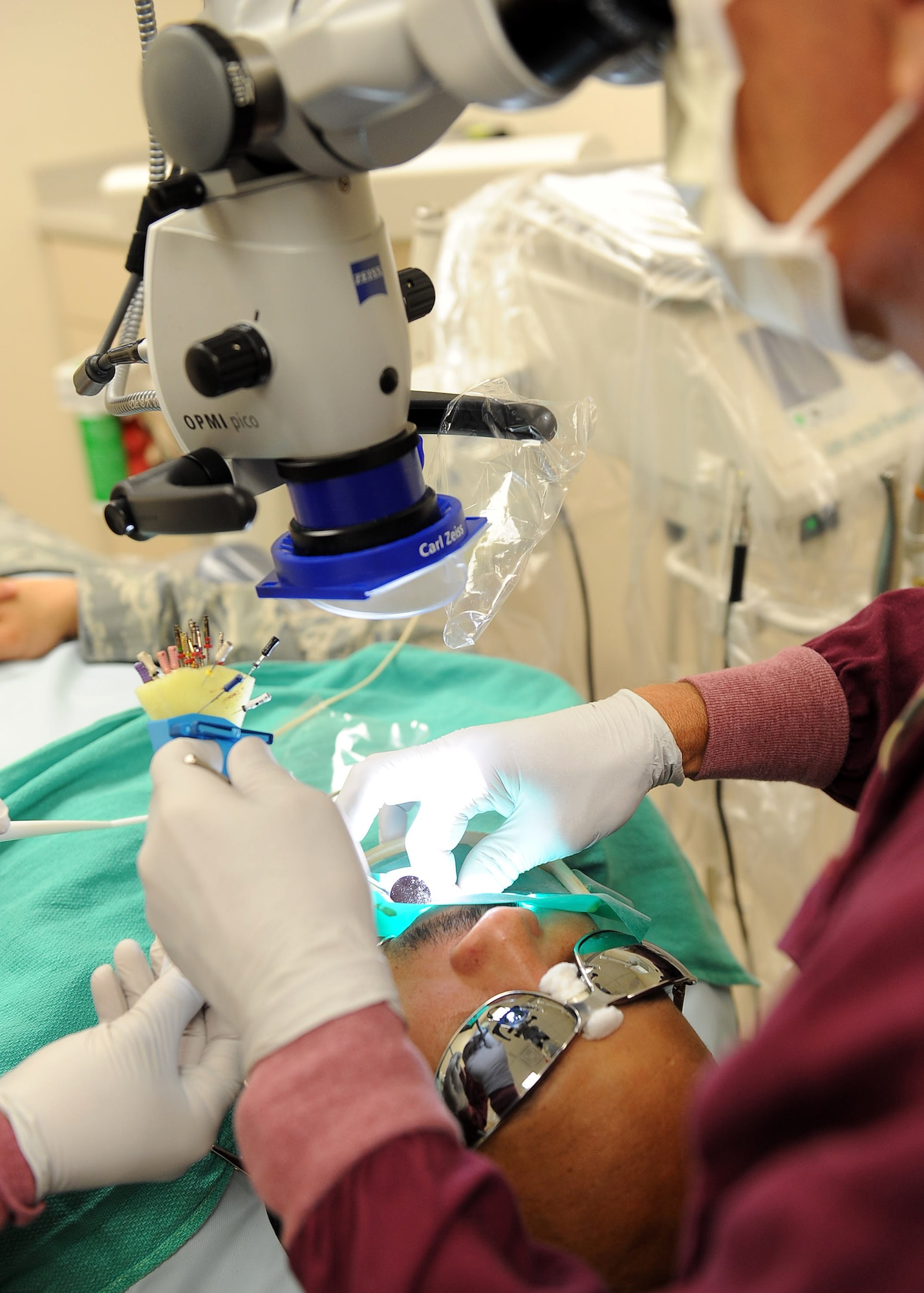 LANGLEY AIR FORCE BASE, Va. -- Dr. Lee Fulsaas, 633d Dental Squadron dental surgeon, performs a root canal on Senior Master Sgt. Dwayne Menefee, 1st Maintenance Operations Squadron superintendent of maintenance operations flight, May 6.  Boasting a 31-room facility and a satellite clinic within the base’s main hospital, the 633 DS provides world-class care in all areas of general dentistry to more than 37,000 patients annually. (U.S. Air Force photo/Airman 1st Class Gul Crockett)