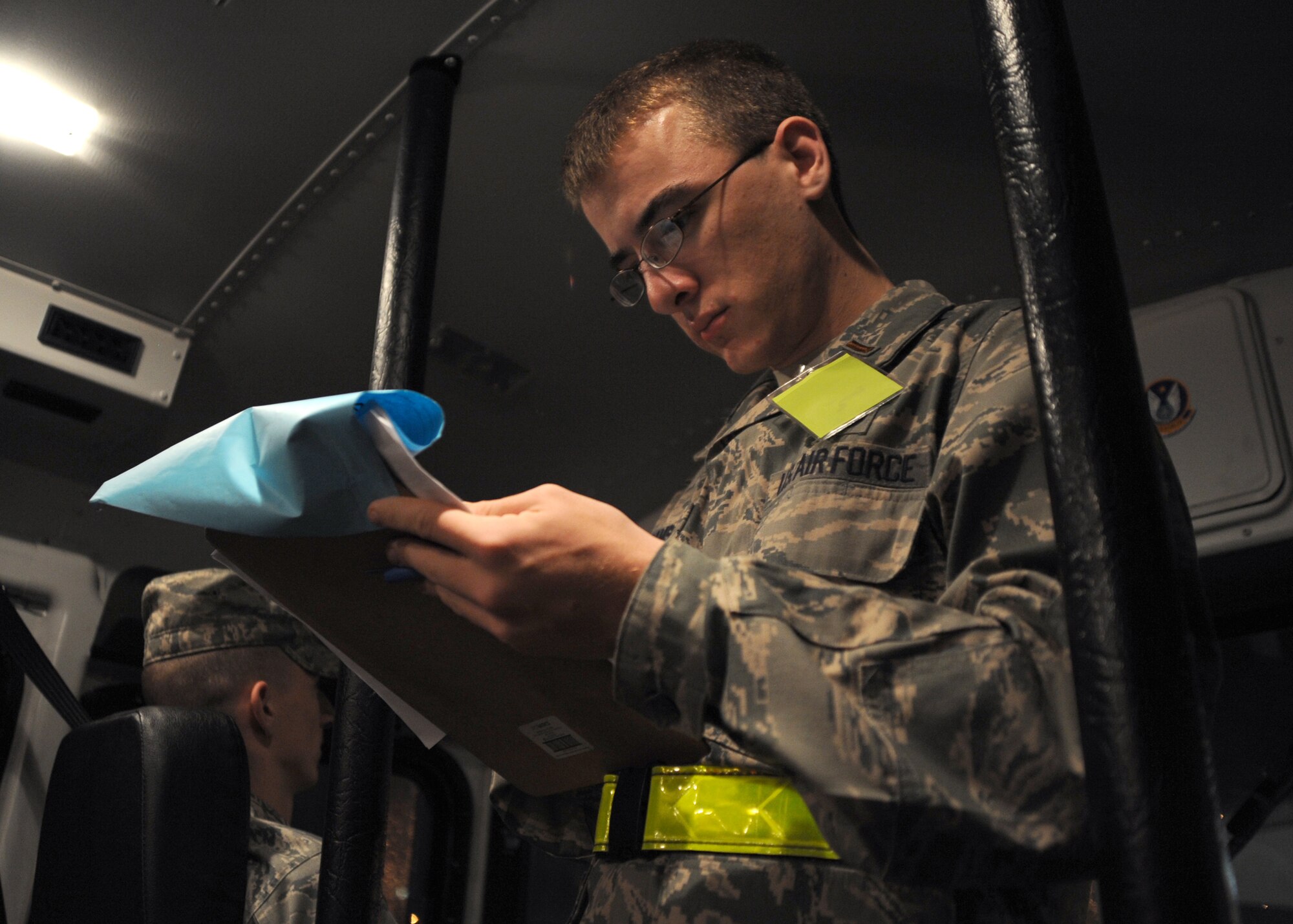 2nd Lt. Michael Adams, 22nd Force Support Squadron force management operations, takes accountability for a bus holding Airmen for pre-deployment processing during an operational readiness exercise May 20, 2010, McConnell Air Force Base, Kan. Ensuring Airmen arrive on time is crucial for the wing’s mission. The exercise included Airmen from almost every unit on base. (U.S. Air Force photo/Airman 1st Class Andrea Salazar)