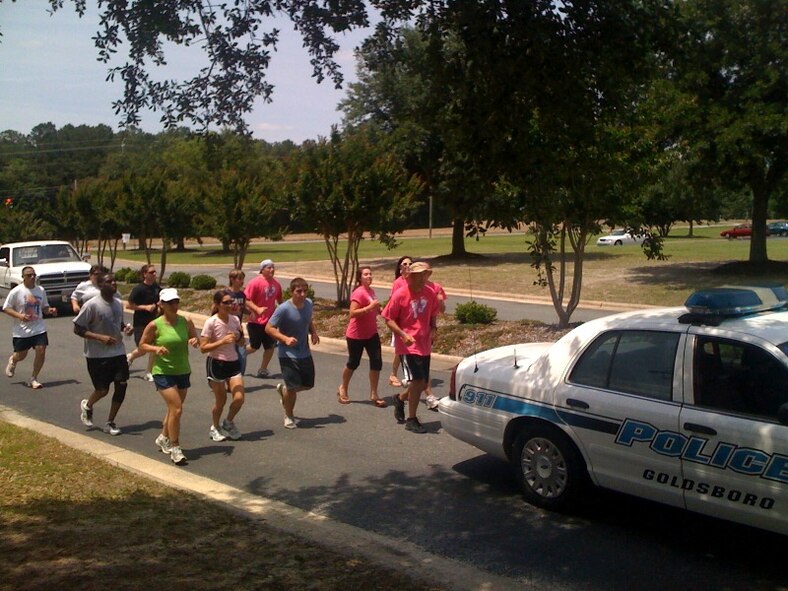 GOLDSBORO, N.C. -- Col. Tim Lamb, 567th RED HORSE Squadron commander, leads the charge as he runs from Duke Hospital in Durham to Wayne Community College in Goldsboro as part of the Relay for Life May 21, 2010. He ran in memory of his wife, Beth, who passed away from breast cancer. He completed the 81.4 mile run in 20 hours and 19 minutes. (Courtesy photo) 