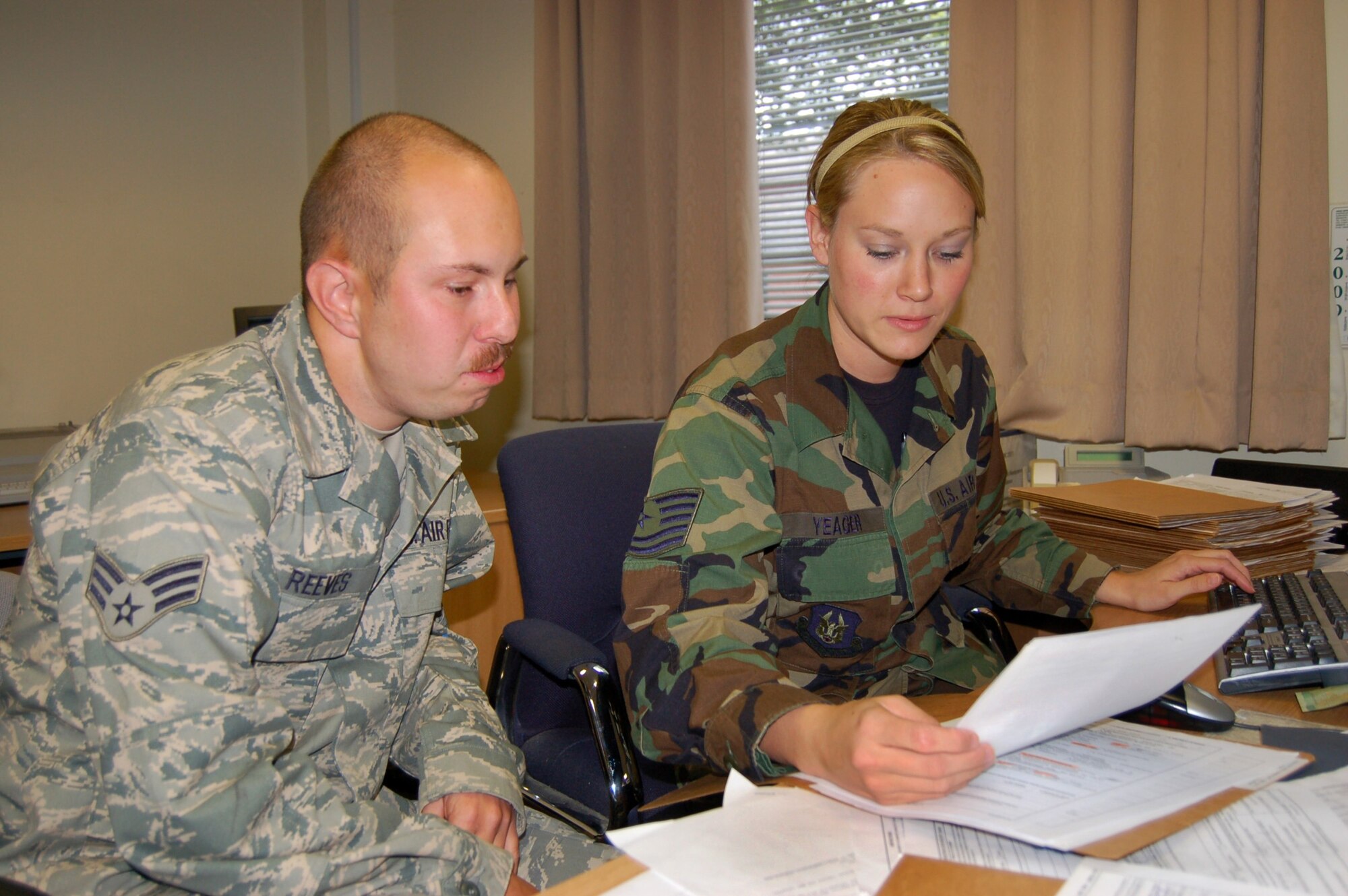 WRIGHT-PATTERSON AIR FORCE BASE, Ohio – Senior Airman Andrew Reeves, shown here with fellow 445th Logistics Readiness Squadron member Tech. Sgt. Kerrie Yeager, was selected as the Traffic Management Airman of the Year, Transportation Award category, Air Force Reserve Command Logistics Readiness Awards for 2009. (U.S. Air Force photo/Maj. Jose Cardenas)