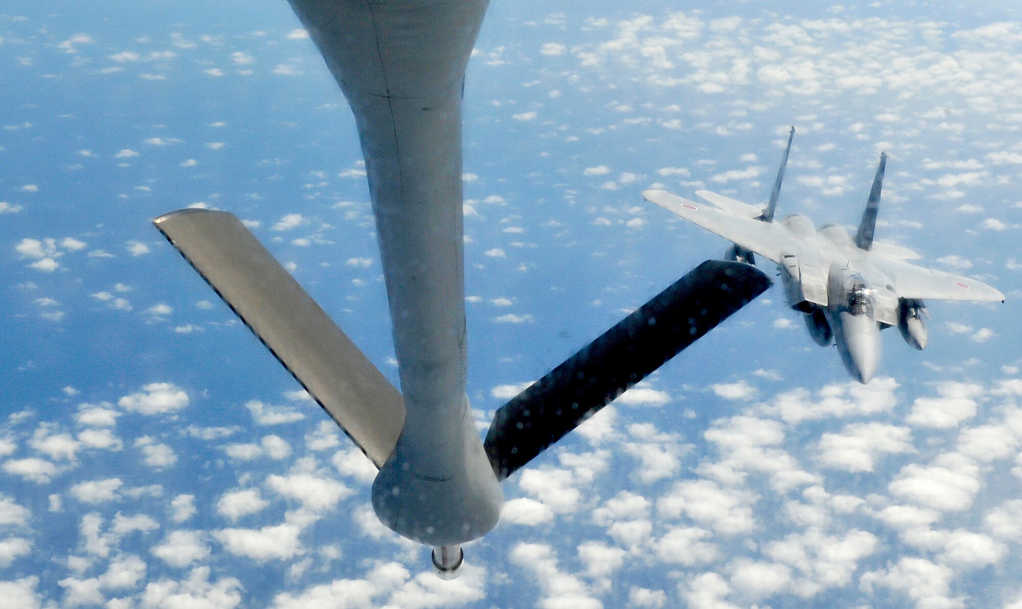 A Japan Air Self Defense Force F-15 Eagle refuels from a 909th Air Refueling Squadron KC-135 Stratotanker during bilateral air refueling training May 17, 2010, at Kadena Air Base, Japan. (U.S. Air Force photo/Tech. Sgt. Chrissy Best)