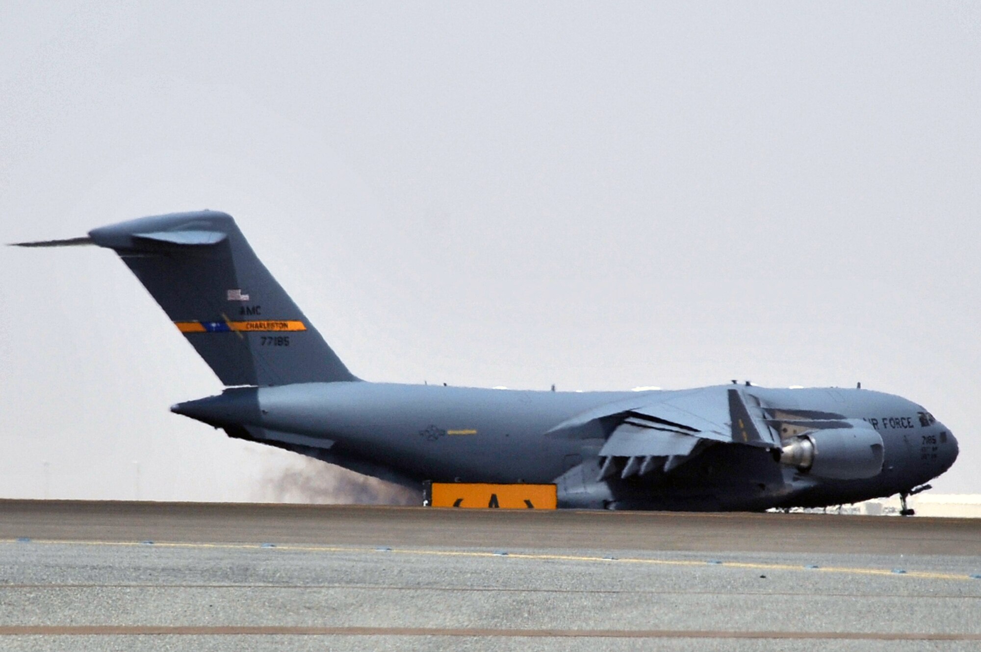 A C-17 Globemaster III deployed from Joint Base Charleston, S.C., comes in for a landing at a non-disclosed base in Southwest Asia after landing May 19, 2010. The C-17 stopped at the base to deliver cargo and passengers for the 380th Air Expeditionary Wing. According to its Air Force fact sheet, the C-17 Globemaster III is the newest, most flexible cargo aircraft to enter the airlift force. The C-17 is capable of rapid strategic delivery of troops and all types of cargo to main operating bases or directly to forward bases in the deployment area. (U.S. Air Force Photo/Master Sgt. Scott T. Sturkol/Released)
