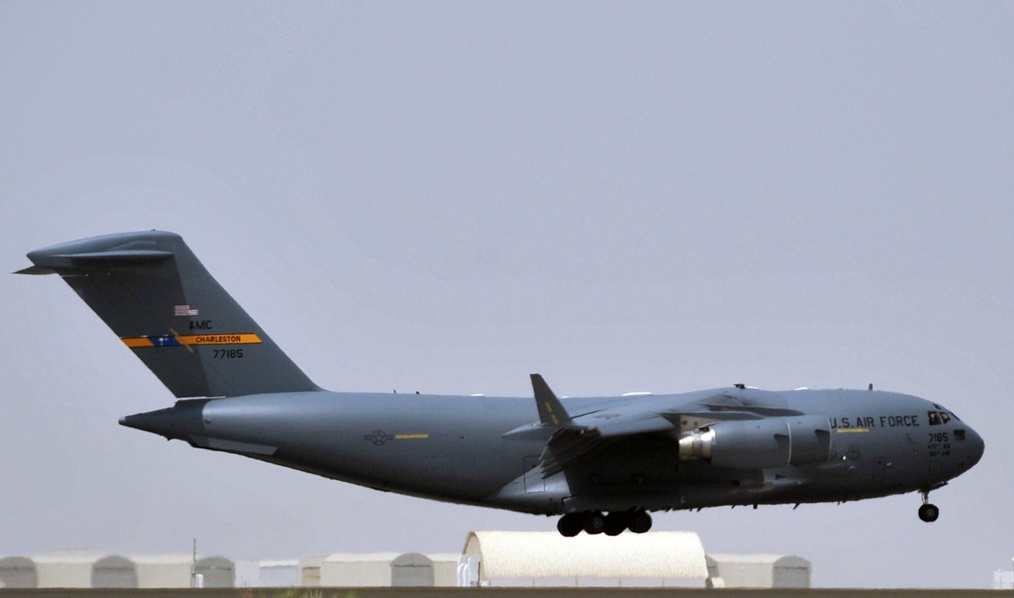 A C-17 Globemaster III deployed from Joint Base Charleston, S.C., comes in for a landing at a non-disclosed base in Southwest Asia after landing May 19, 2010. The C-17 stopped at the base to deliver cargo and passengers for the 380th Air Expeditionary Wing. According to its Air Force fact sheet, the C-17 Globemaster III is the newest, most flexible cargo aircraft to enter the airlift force. The C-17 is capable of rapid strategic delivery of troops and all types of cargo to main operating bases or directly to forward bases in the deployment area. (U.S. Air Force Photo/Master Sgt. Scott T. Sturkol/Released)