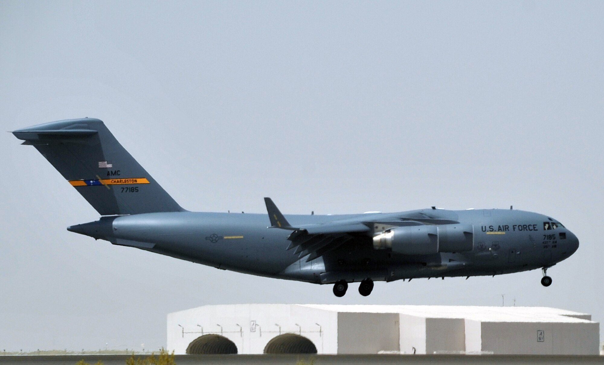 A C-17 Globemaster III deployed from Joint Base Charleston, S.C., taxis down the runway at a non-disclosed base in Southwest Asia after landing May 19, 2010. The C-17 stopped at the base to deliver cargo and passengers for the 380th Air Expeditionary Wing. According to its Air Force fact sheet, the C-17 Globemaster III is the newest, most flexible cargo aircraft to enter the airlift force. The C-17 is capable of rapid strategic delivery of troops and all types of cargo to main operating bases or directly to forward bases in the deployment area. (U.S. Air Force Photo/Master Sgt. Scott T. Sturkol/Released)