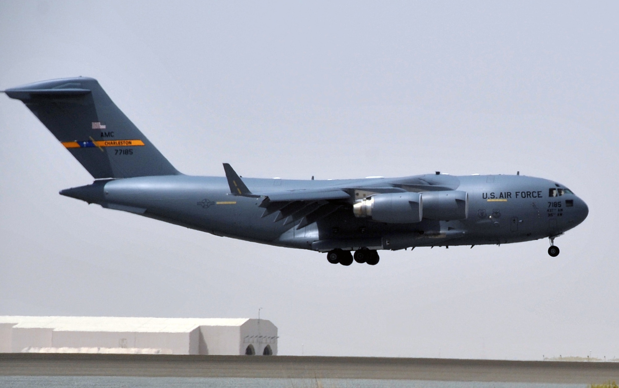 A C-17 Globemaster III deployed from Joint Base Charleston, S.C., comes in for a landing at a non-disclosed base in Southwest Asia after landing May 19, 2010. The C-17 stopped at the base to deliver cargo and passengers for the 380th Air Expeditionary Wing. According to its Air Force fact sheet, the C-17 Globemaster III is the newest, most flexible cargo aircraft to enter the airlift force. The C-17 is capable of rapid strategic delivery of troops and all types of cargo to main operating bases or directly to forward bases in the deployment area. (U.S. Air Force Photo/Master Sgt. Scott T. Sturkol/Released)