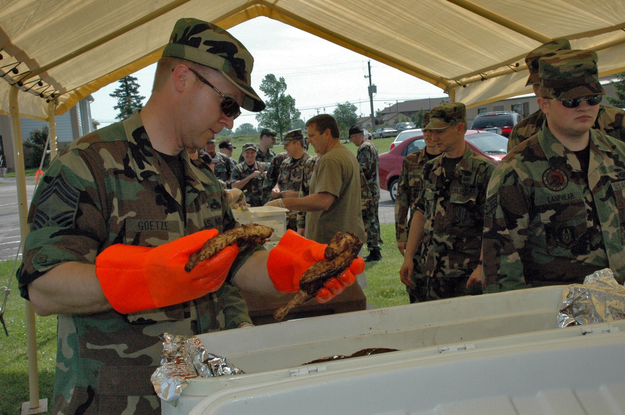 Chief Master Sgt. Scott Goetze serves barbecued chicken at the 2nd annual 914th Airlift Wing Chief's Group Chicken BBQ fundraiser June 7, 2008 Niagara Falls Air Reserve Station, Niagara Falls NY. The annual chicken BBQ raises money for the Chiefs? Group Scholarship Fund. (U.S. Air Force photo by Staff Sgt. Joseph McKee)