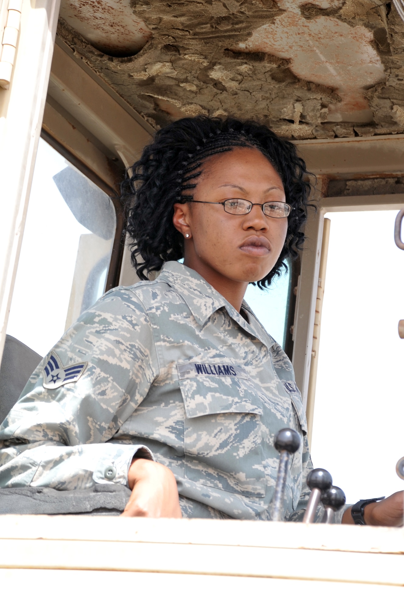 Senior Airman Brittny Williams, an air transportation journeyman with the 380th Expeditionary Logistics Readiness Squadron's Air Terminal Operations Center, drives an extreme terrain forklift during operations at a non-disclosed base in Southwest Asia. Airman Williams is deployed from the 89th Aerial Port Squadron at Joint Base Andrews, Md., and her hometown areas are Sherrlls Ford and Catawba County, N.C. (U.S. Air Force Photo/Master Sgt. Scott T. Sturkol/Released)