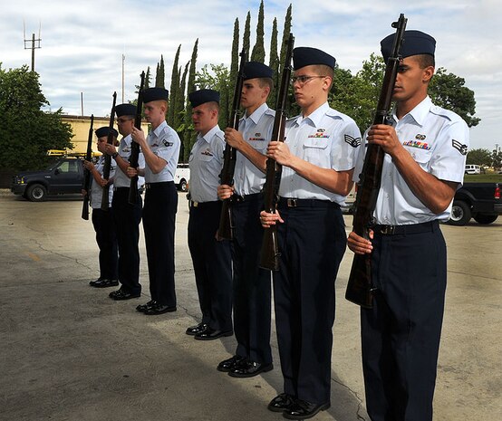 The Beale drill team practices a new routine May 24 outside building 1086. The drill team has been practicing vairous drills and learning new moves for about one month. (U.S. Air Force photo by Airman 1st Class David Tracy)