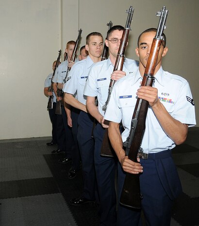 The new Beale drill team perfects their moves May 24 at building 1086. The team, formed about one month ago, currently has 10 members total from the Honor Guard detail. (U.S. Air Force photo by Airman 1st Class David Tracy)