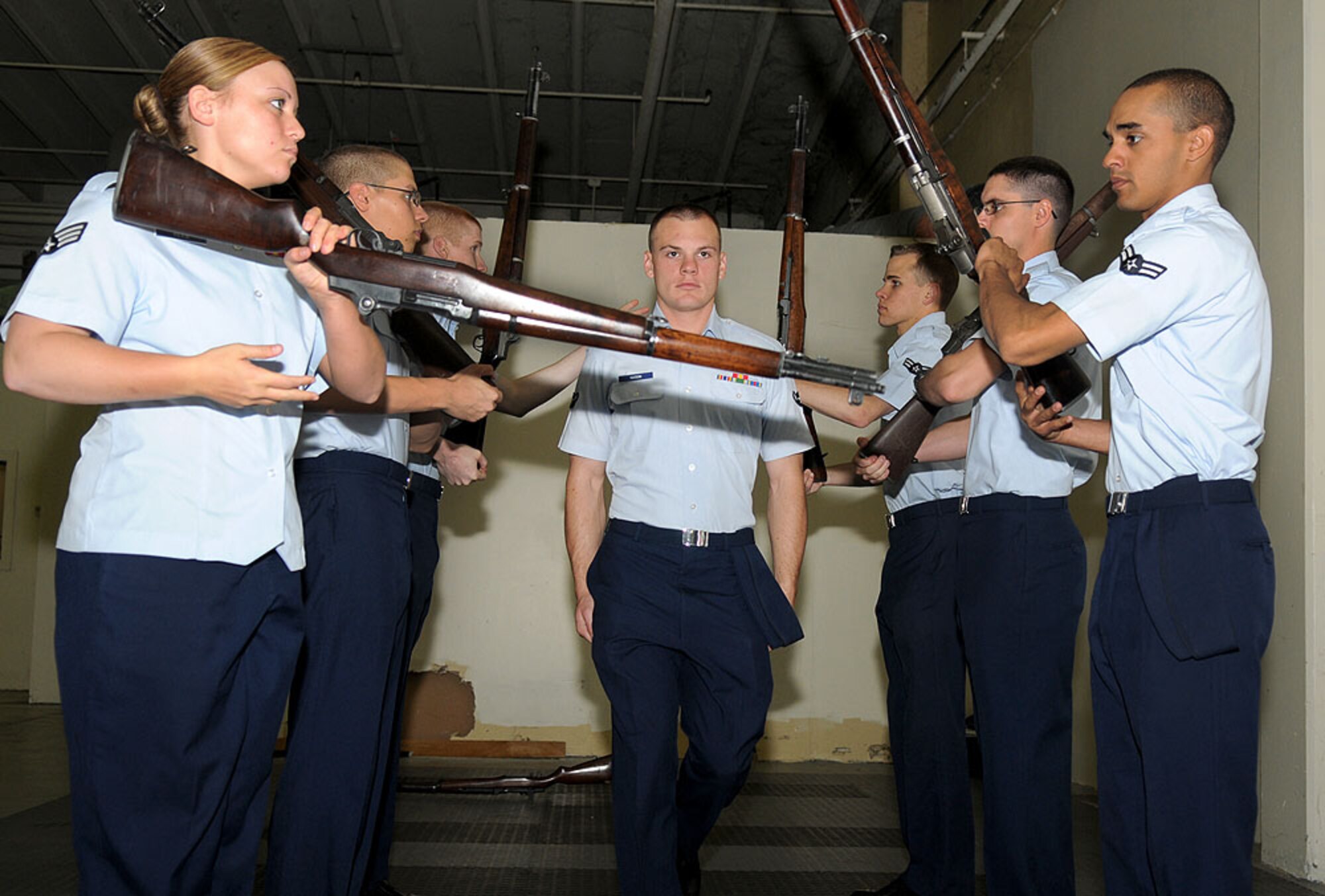 Airmen on Beale’s drill team perform a routine they call “The Gauntlet” during their drill practice May 24 at building 1086. The team of seven practics approximately four hours a day to perfect their routines. (U.S. Air Force photo by Airman 1st Class David Tracy)