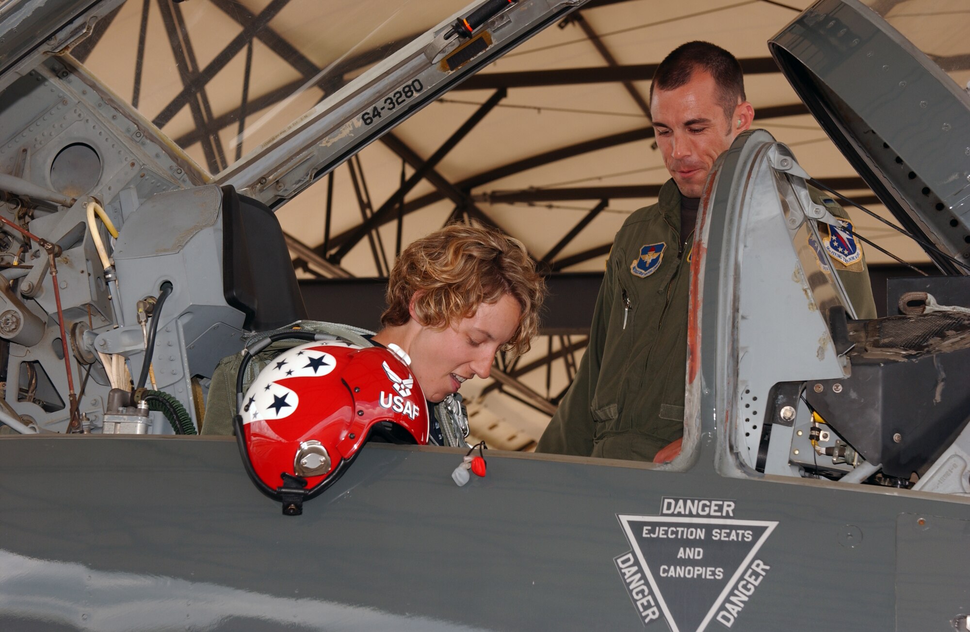 First Lt. Russell Hobbs, 50th Flying Training Squadron training flight instructor, completes the morning-long egress training for Capt. Kristin Hubbard as she prepares for a T-38C flight May 18 at Columbus AFB, Miss. (U.S. Air Force Photo/Tammi Baudoin).