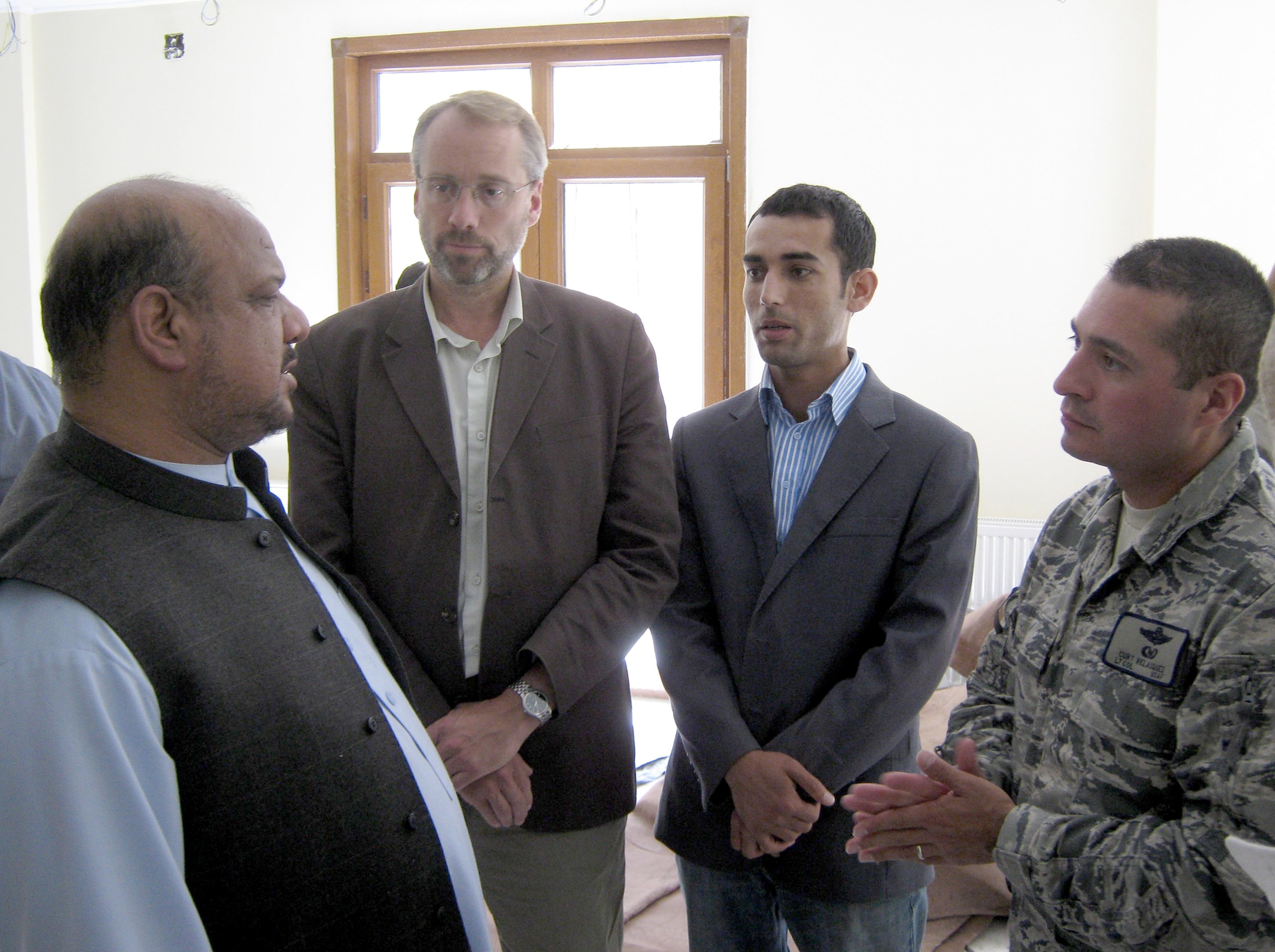 (Left to right) First Vice President Mohammad Qasim Fahim, James DeHart, Khalid Siddiqi and Lt. Col. Curtis Velasquez  talk during a meeting at Mr. Fahim’s home in the Khenj District May 20, 2010, in the Panjshir Province, Afghanistan.  Mr. Fahim is the Afghanistan First Vice President, Mr. DeHart is the U.S. Department of State and Provincial Reconstruction Team Panjshir director, Mr. Siddiqi is the PRT Panjshir political adviser and Colonel Velasquez is the PRT Panjshir commander. (Photo/U.S. Air Force 2nd Lt. Jason Smith)