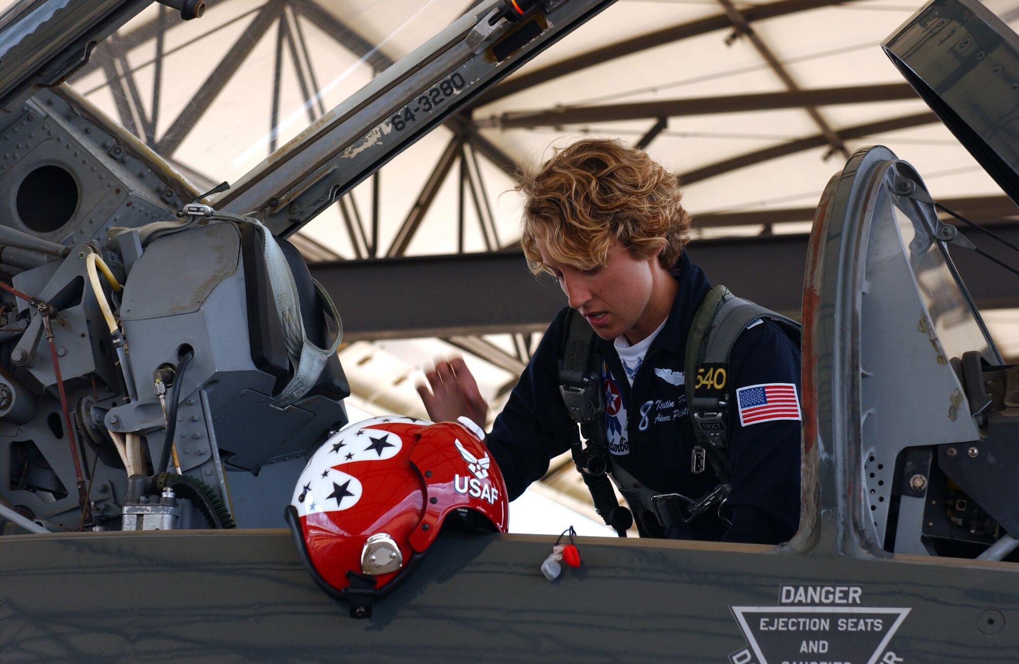 Thunderbird number eight, Capt. Kristin Hubbard, climbs into a T-38C in preparation of an orientation flight May 18 at Columbus AFB, Miss.  Captain Hubbard is a 2002 ROTC graduate from the University of Washington in Seattle and has over 1,000 flying hours. (U.S. Air Force Photo/Tammi Baudoin).