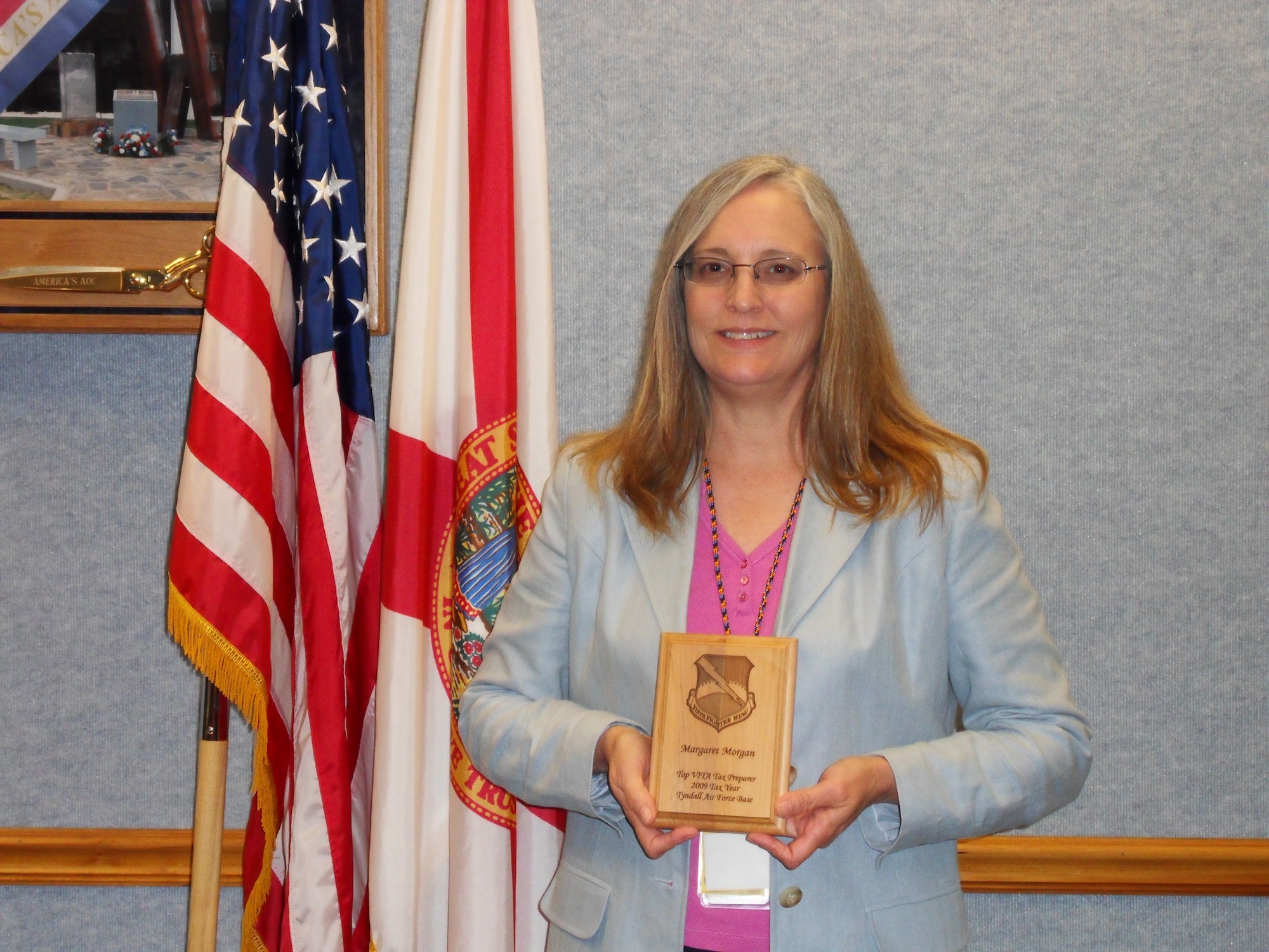 Margaret Morgan, 601st Air Operations Center Mission Support Division secretary, poses with her Tyndall Air Force Base Top Volunteer tax preparer plaque for the 2009 tax season.  (Courtesy photo)