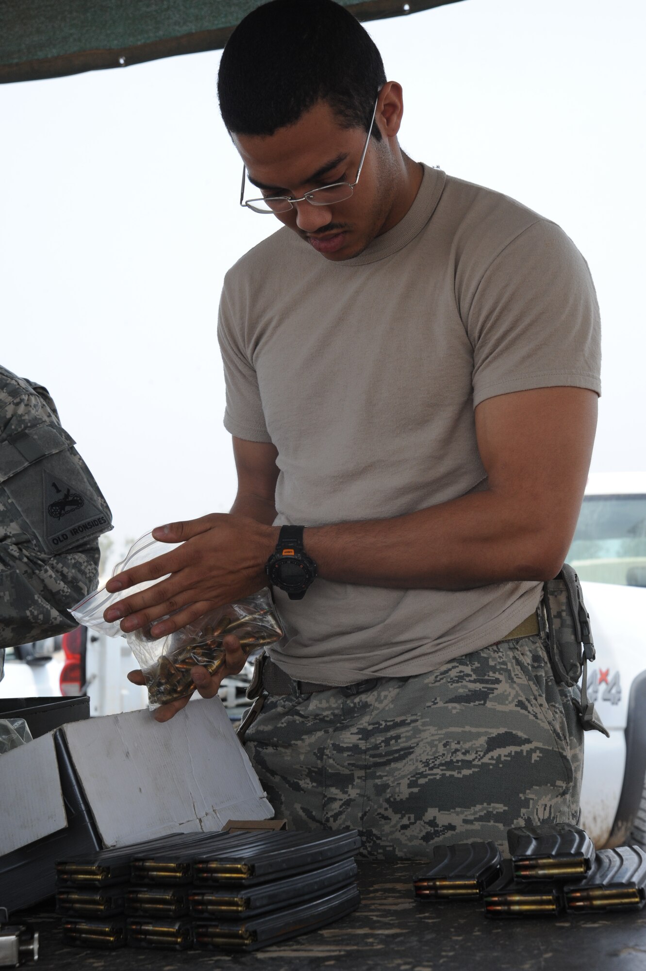 Air Force Airman 1st Class Jerome Williams, Det 2, 82nd Expeditionary Air Support Operations Squadron Tactical Air Control Party, loaded magazines in preparation for a tactical shoot March 26, this shoot helped him hone his skills while in the area of operation. Airman Williams is deployed from Army Garrison Heidelberg, Germany. (U.S. Air Force photo/Senior Airman Jarrod R. Chavana)
