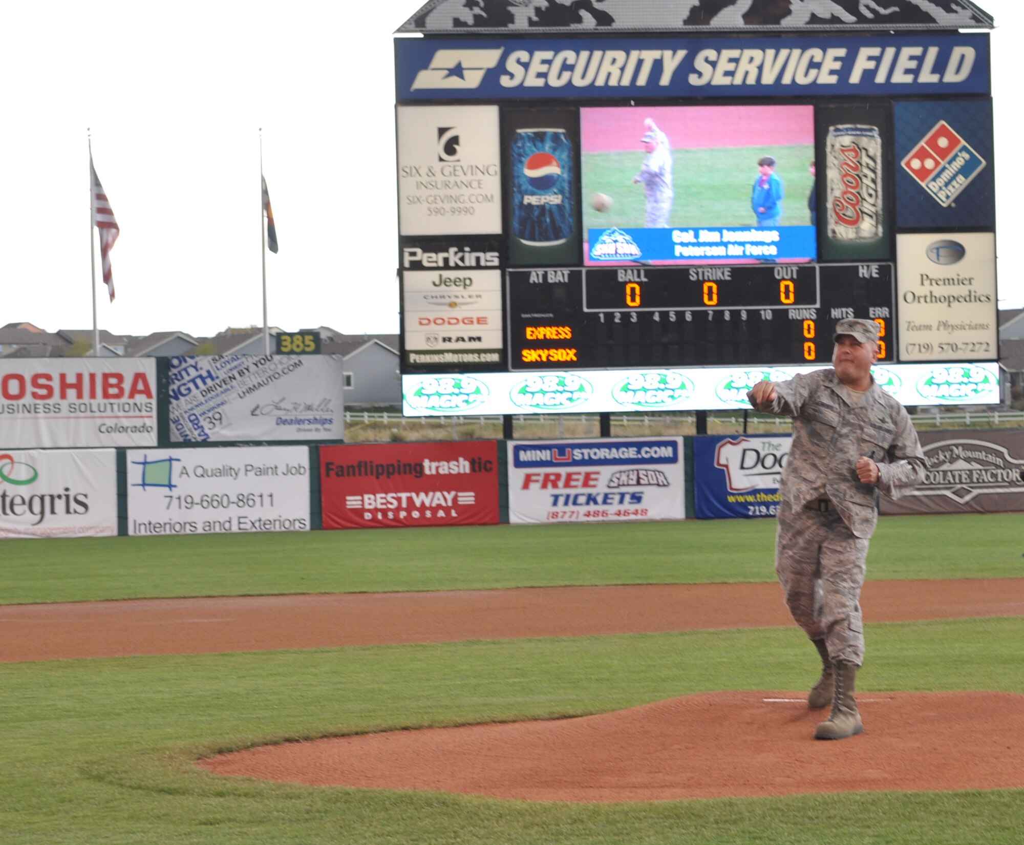 Col. Jim Jennings, 21st Space Wing vice commander, throws out the ceremonial first pitch at Sky Sox stadium May 15, as part of military appreciation night. The High Frontier Honor Guard also took part in the evening’s festivities, presenting the colors before the game. The Sky Sox did not fare well in the match against the Texas team: the Round Rock Express beat the Sky Sox 16-4. (U.S. Air Force photo/Warren Schroeder)