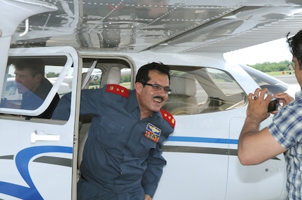 Maj. Gen. Mohammad Dawran, Afghan National Army Air Corps commander, exits the cockpit of a Cessna 172 after an orientation flight around Stinson Municipal Airport.  (U.S. Air Force photo by Rich McFadden)