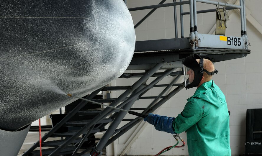 MOODY AIR FORCE BASE, Ga. -- Airman 1st Class Mikel Dye, 23rd Equipment Maintenance Squadron crew chief, sprays cleaning soap on the front of a HC-130P Combat King during an aircraft wash here  May 17. During the wash, Airman Dye removed dirt and build-up from the nose of the C-130 that accumulated during constant flying. (U.S. Air Force photo by Airman 1st Class Joshua Green/RELEASED)