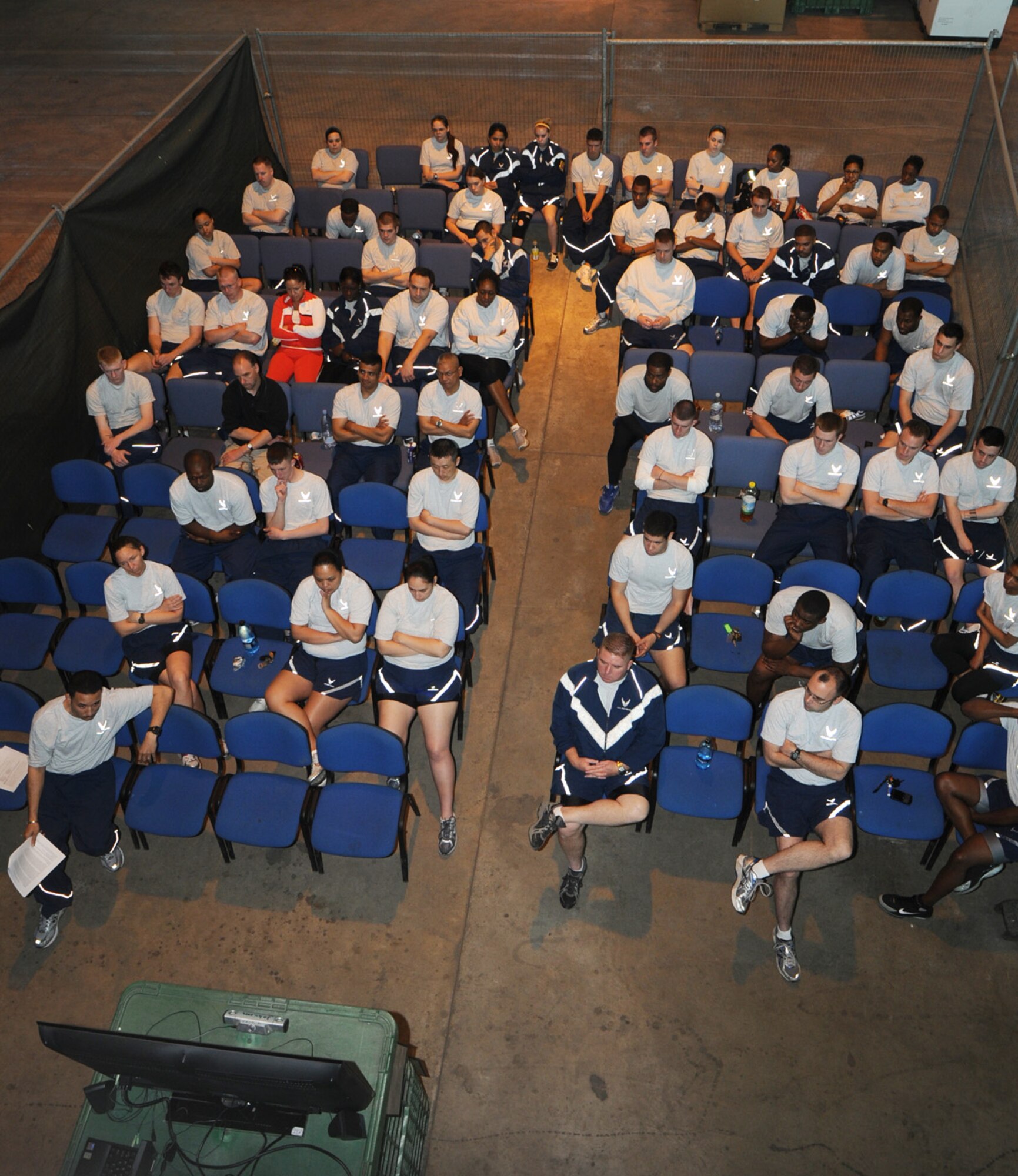 Members from the 100th Logistics Readiness Squadron watch a slide presentation on suicide prevention awareness in Building 550, as part of the 100th Air Refueling Wing Safety Stand-down event May 21. Squadrons base-wide participated in the event with various safety briefings and demonstrations. (U.S. Air Force photo/Karen Abeyasekere)