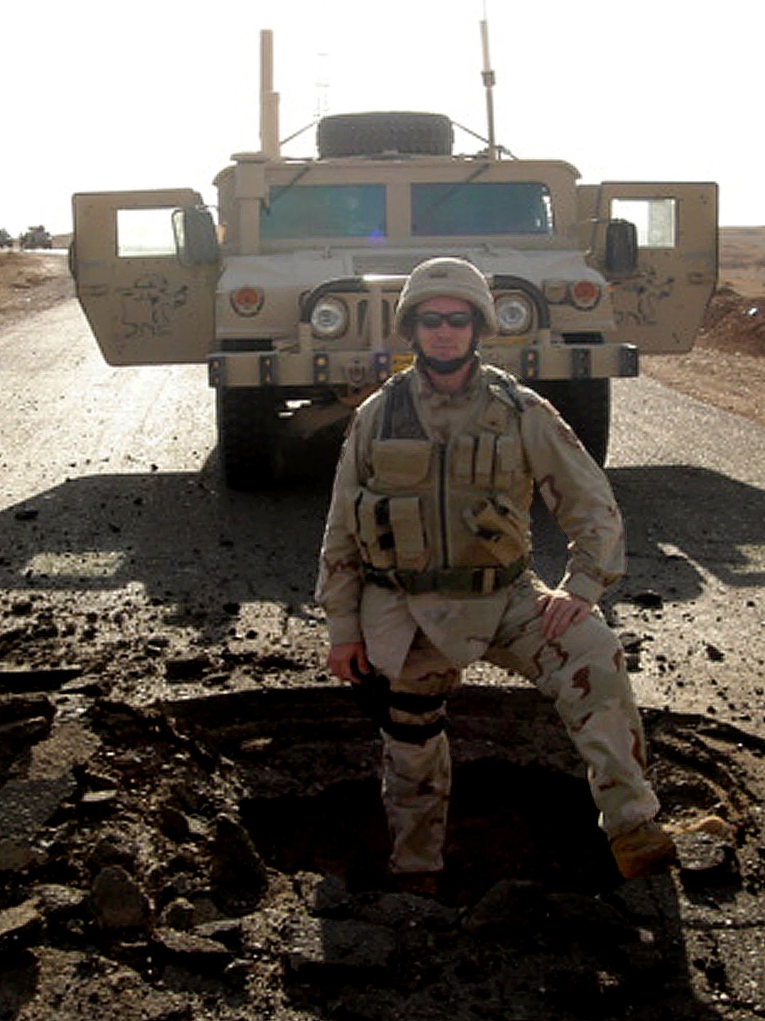 TIKRIT, Iraq -- Master Sgt. Van Hood stands in the middle of a crater created by an improvised explosive device near Tikrit, Iraq. Since beginning his Air Force career in 1994, Sergeant Hood has deployed seven times and earned three Bronze Star Medals. Sergeant Hood, 4th Civil Engineer Squadron EOD NCOIC of operations, plans and intel, is a native of Greensboro, N.C. (Courtesy photo)