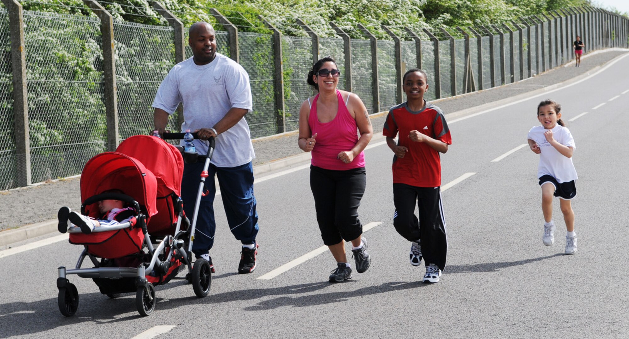 Families also took part in the Team Mildenhall 5K fun run May 21 held near the Hardstand Fitness Center. Hundreds of Airmen, along with spouses, children and dogs, took part in the event. (U.S. Air Force photo/Karen Abeyasekere)