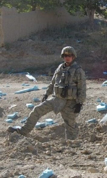 WARDAK PROVINCE, Afghanistan -- Master Sgt. Van Hood stands surrounded by debris from an improvised explosive device in the Wardak province in Afghanistan. Sergeant Hood, 4th Civil Engineer Squadron Explosive Ordnance Disposal NCOIC of operations, plans and intel, earned his third Bronze Star Medal for actions during a recent six-month deployment. The Bronze Star Medal is the fourth-highest combat medal in the armed forces. Sergeant Hood is a native of Greensboro, N.C. (Courtesy photo)