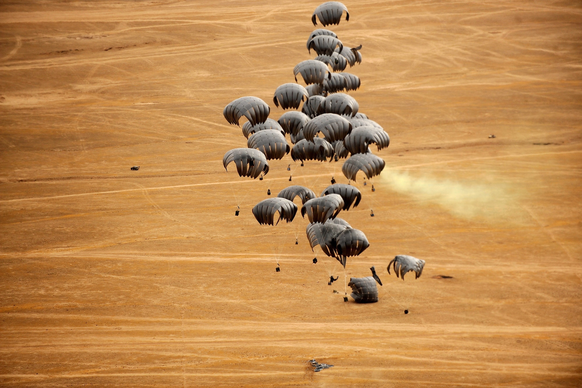 Forty container-delivery-system bundles, parachute to the ground from a C-17 Globemaster III May 9, 2010,  over a drop zone in Afghanistan. (U.S. Air Force photo/Staff Sgt. Manuel J. Martinez/released)