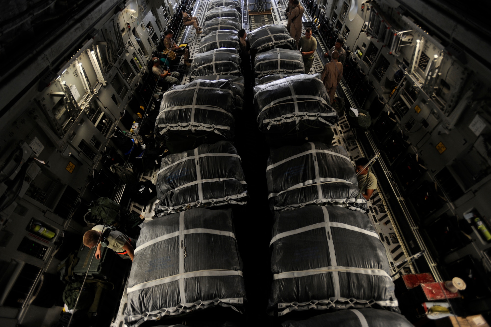 Aerial porters assigned to the 8th Expeditionary Aircraft Maintenance Squadron, and  loadmasters assigned to the 816th Expeditionary Airlift Squadron, load 40 container-delivery-system bundles aboard a C-17 Globemaster III for an airdrop mission May 9, 2010, at a base in Southwest Asia. (U.S. Air Force photo/Staff Sgt. Manuel J. Martinez/released)
