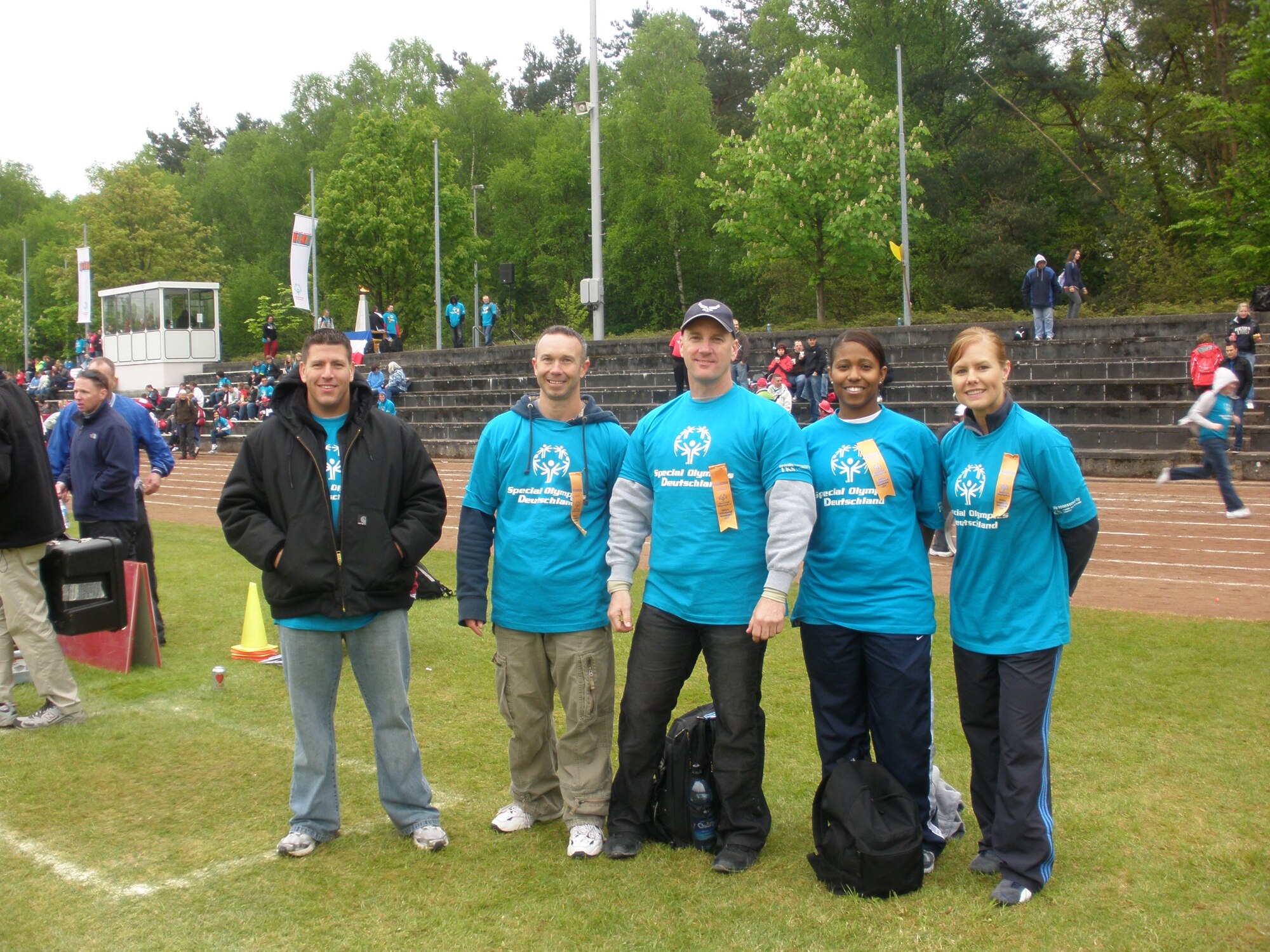 KAISERSLAUTERN, Germany – From left to right: Tech. Sgt. Austin Lewis, Master Sgt. Anthony Bickerton, Master Sgt. Brian Rogers, Staff Sgt. Brandi Washington and Shari Sims, all from the 726th Air Mobility Squadron, volunteer their time at the Special Olympics Day May 12 in Kaiserslautern, Germany. The volunteers are members of Spangdahlem’s local Airlift Tanker Association chapter, the Halvorson Chapter. (U.S. Air Force photo/Staff Sgt. Candace Sloan)