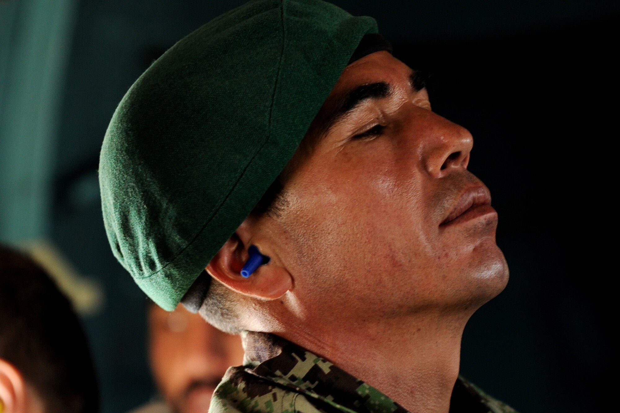 An Afghan National Army Air Corps soldier takes a moment to pray during an Mi-17 helicopter flight May 13, 2010, over Afghanistan. (U.S. Air Force photo/Staff Sgt. Manuel J. Martinez/released) 