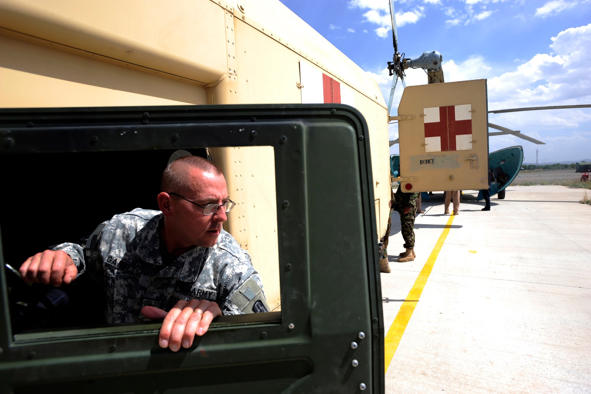 U.S. Army Staff Sgt. James Garbett, an emergency-medical technician assigned to the 452nd Combat Support Hospital, arrives at an Mi-17 helicopter to help unload patients and get them to the Salerno Hospital, May 12, 2010, at Forward Operation Base Salerno, Afghanistan. (U.S. Air Force photo/Staff Sgt. Manuel J. Martinez/released) 