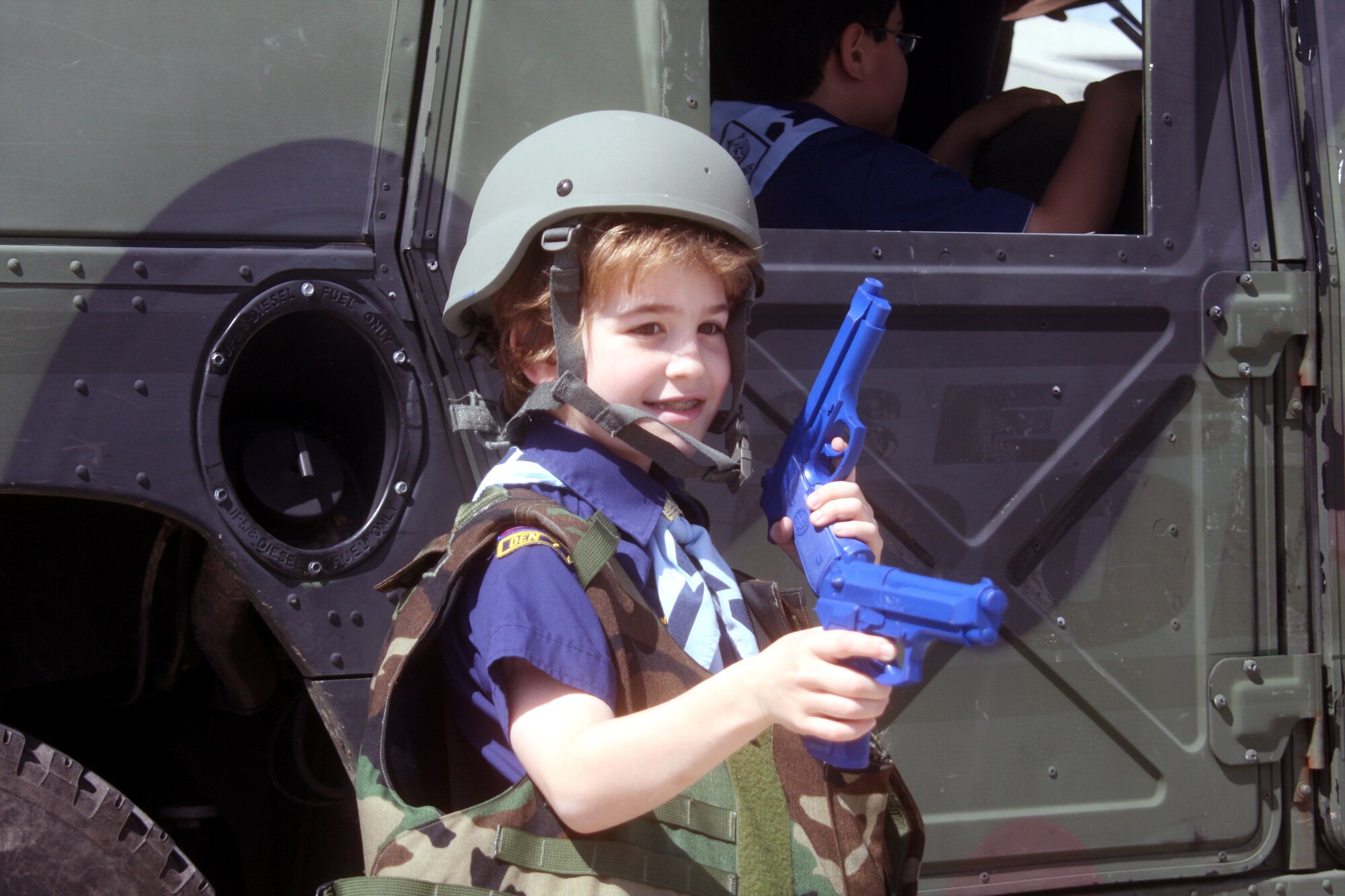 WRIGHT-PATTERSON AIR FORCE BASE, Ohio - Noan Jackson is trying out combat gear at the security forces display. More than 400 Boy and Girl Scouts from Ohio, Kentucky and Michigan, attended the 445th Airlift Wing’s first Scout Day May 15. (U.S.  Air Force photo/Senior Airman Mikhail Berlin)