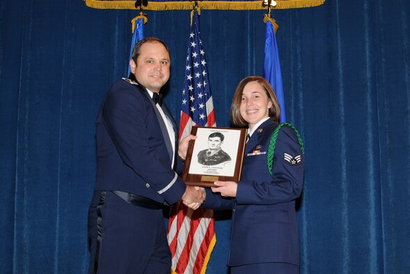 McGHEE TYSON AIR NATIONAL GUARD BASE, Tenn. -- Senior Airman Jessica N. Webb, right, a command post controller with the 118th Airlift Wing in Nashville, Tenn., receives the John L. Levitow honor award for Airman Leadership School Class 10-3 at The I.G. Brown Air National Guard Training and Education Center here from Maj. James K. Evans, TEC TV branch chief, May 20, 2010.  The John L. Levitow award is the highest honor awarded a graduate of any Air Force enlisted professional military education course.  (U.S. Air Force photo by Master Sgt. Kurt Skoglund/Released)