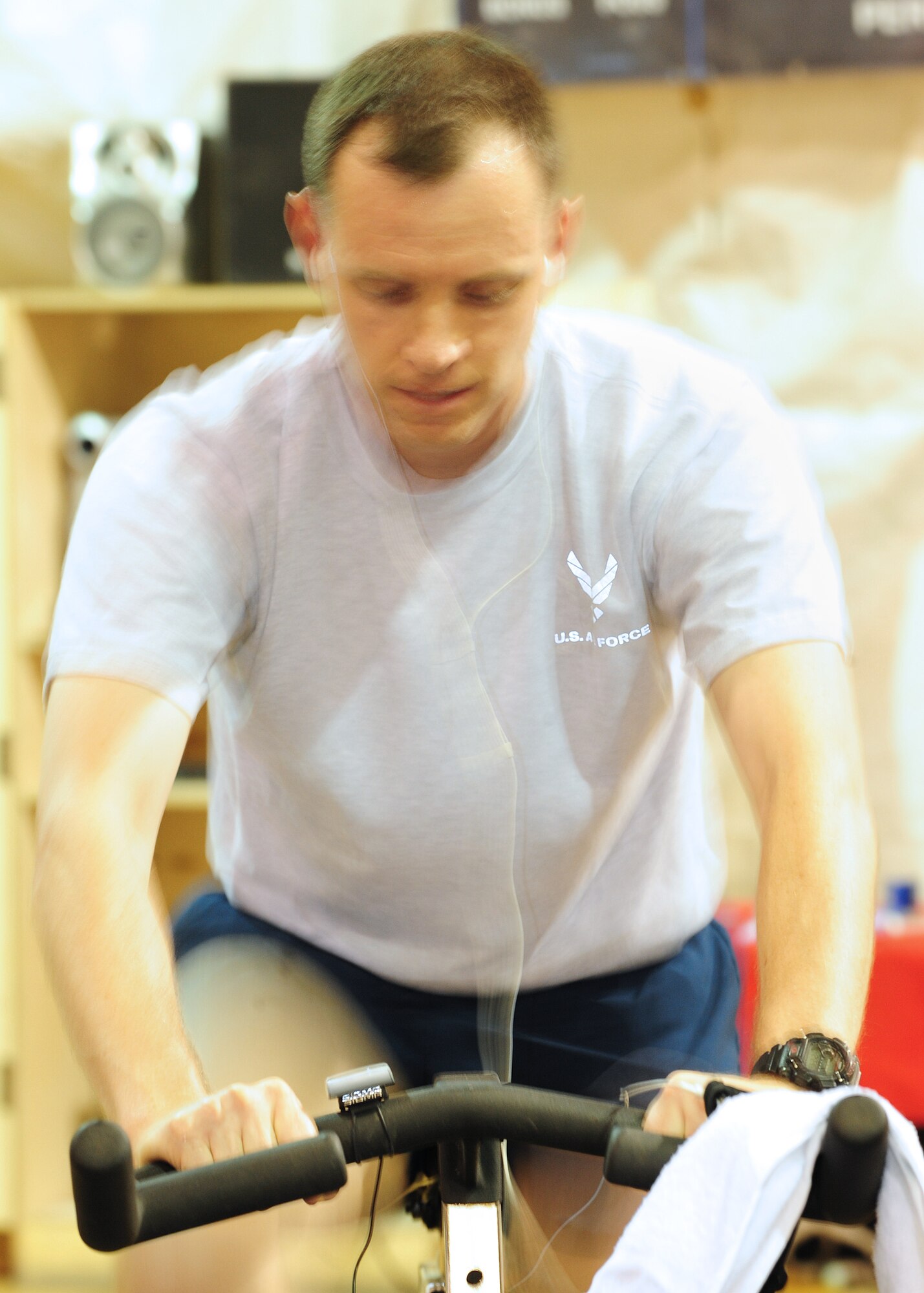 Maj. Shawn McKelvy, an Airman from the Transit Center at Manas, Kyrgyzstan, completes his first hour of biking during a "Bike Your Heart Out" bike-a-thon here May 18-19, 2010. The "300 Lives in 30 Days" fundraiser, which lasted for a month, culminated with the ride and resulted in $50,000 for the children's heart surgery fund -enough to fund almost 90 more surgeries for children. (U.S. Air Force photo/Senior Airman Nichelle Anderson/ released)