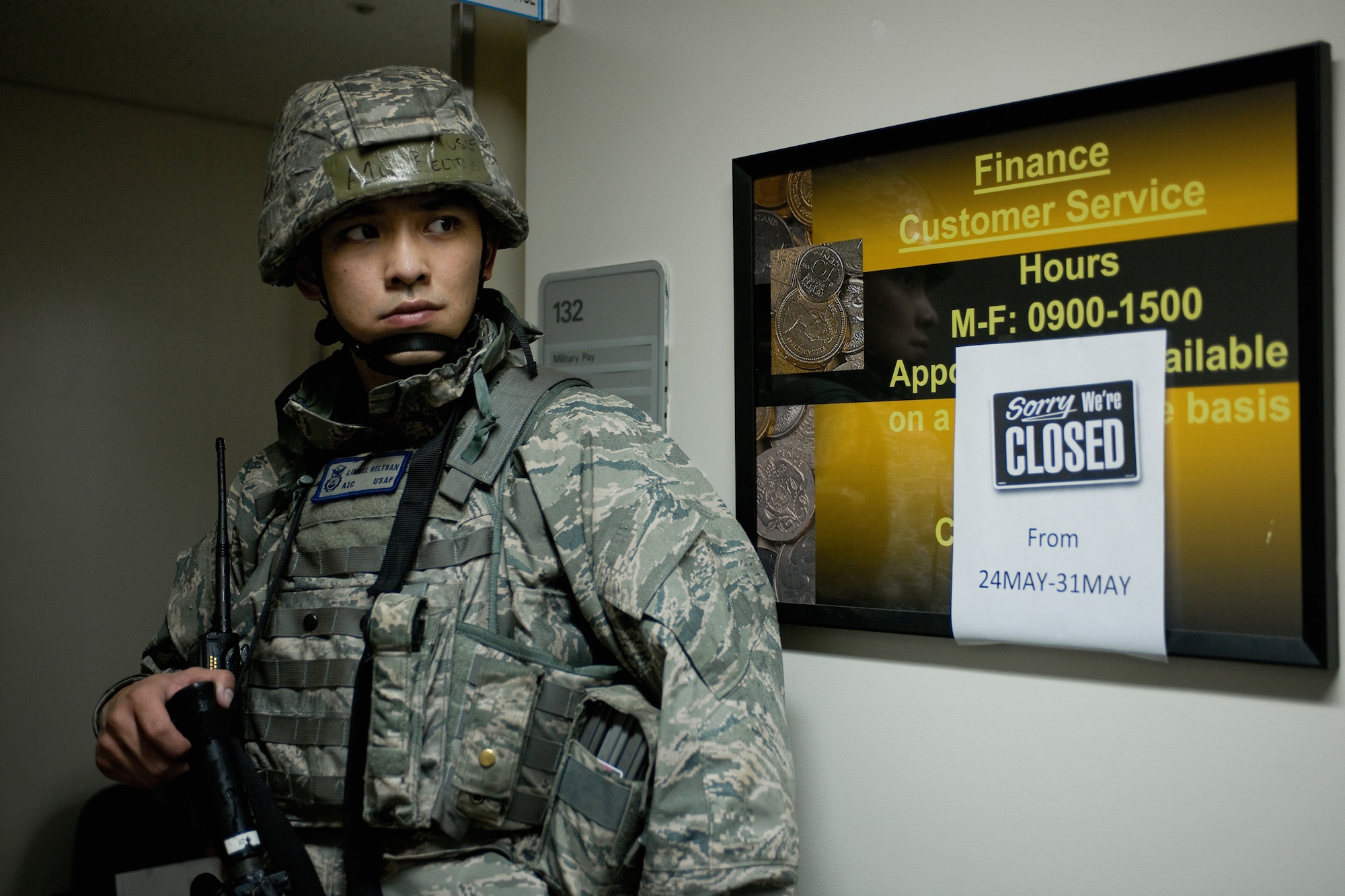 YOKOTA AIR BASE, Japan -- Airman 1st Class Limuel Beltran, 374th Security Force Squadron, guards a robbery scene here May 24 during the Operational Readiness Exercise. (U.S. Air Force photo/Osakabe Yasuo)