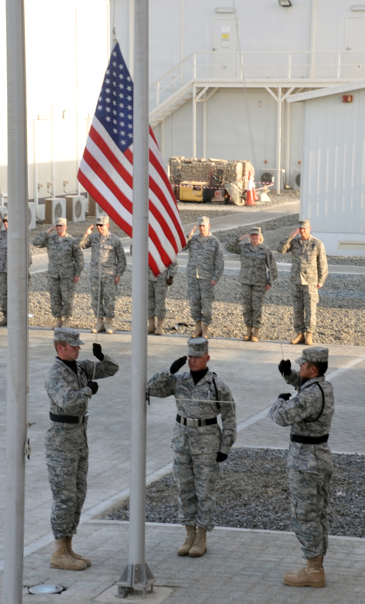 Airmen participate in a retreat ceremony May 21, 2010, at a non-disclosed base in Southwest Asia. The 380th Air Expeditionary Wing staff served as the lead unit in formation for the ceremony. Every week, the 380th AEW holds a retreat ceremony to honor the American flag and what it stands for. The 380th AEW supports operations Iraqi Freedom and Enduring Freedom and the Combined Joint Task Force-Horn of Africa. (U.S. Air Force Photo/Master Sgt. Scott T. Sturkol/Released)
