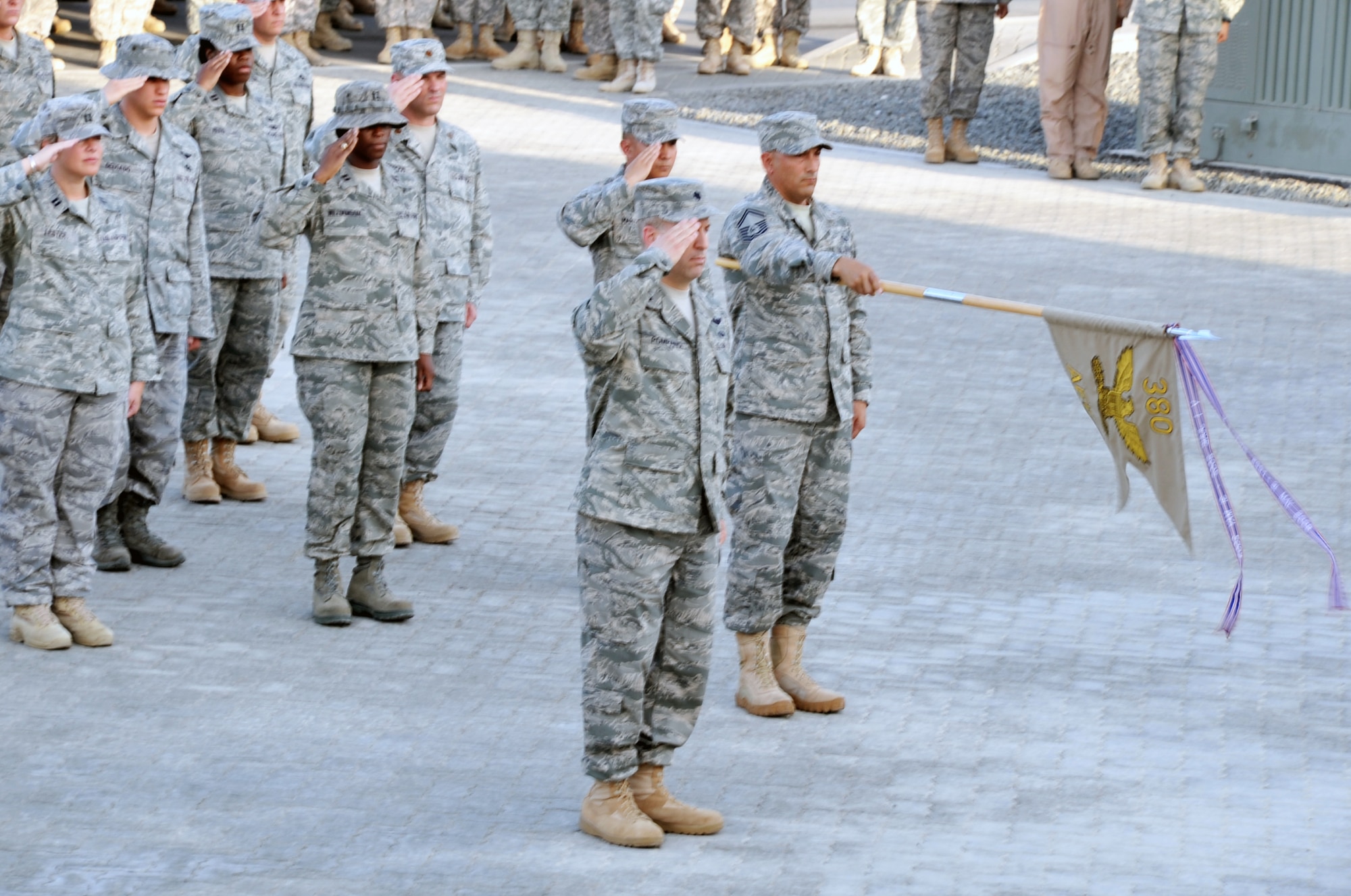 Airmen participate in a retreat ceremony May 21, 2010, at a non-disclosed base in Southwest Asia. The 380th Air Expeditionary Wing staff served as the lead unit in formation for the ceremony. Every week, the 380th AEW holds a retreat ceremony to honor the American flag and what it stands for. The 380th AEW supports operations Iraqi Freedom and Enduring Freedom and the Combined Joint Task Force-Horn of Africa. (U.S. Air Force Photo/Master Sgt. Scott T. Sturkol/Released)
